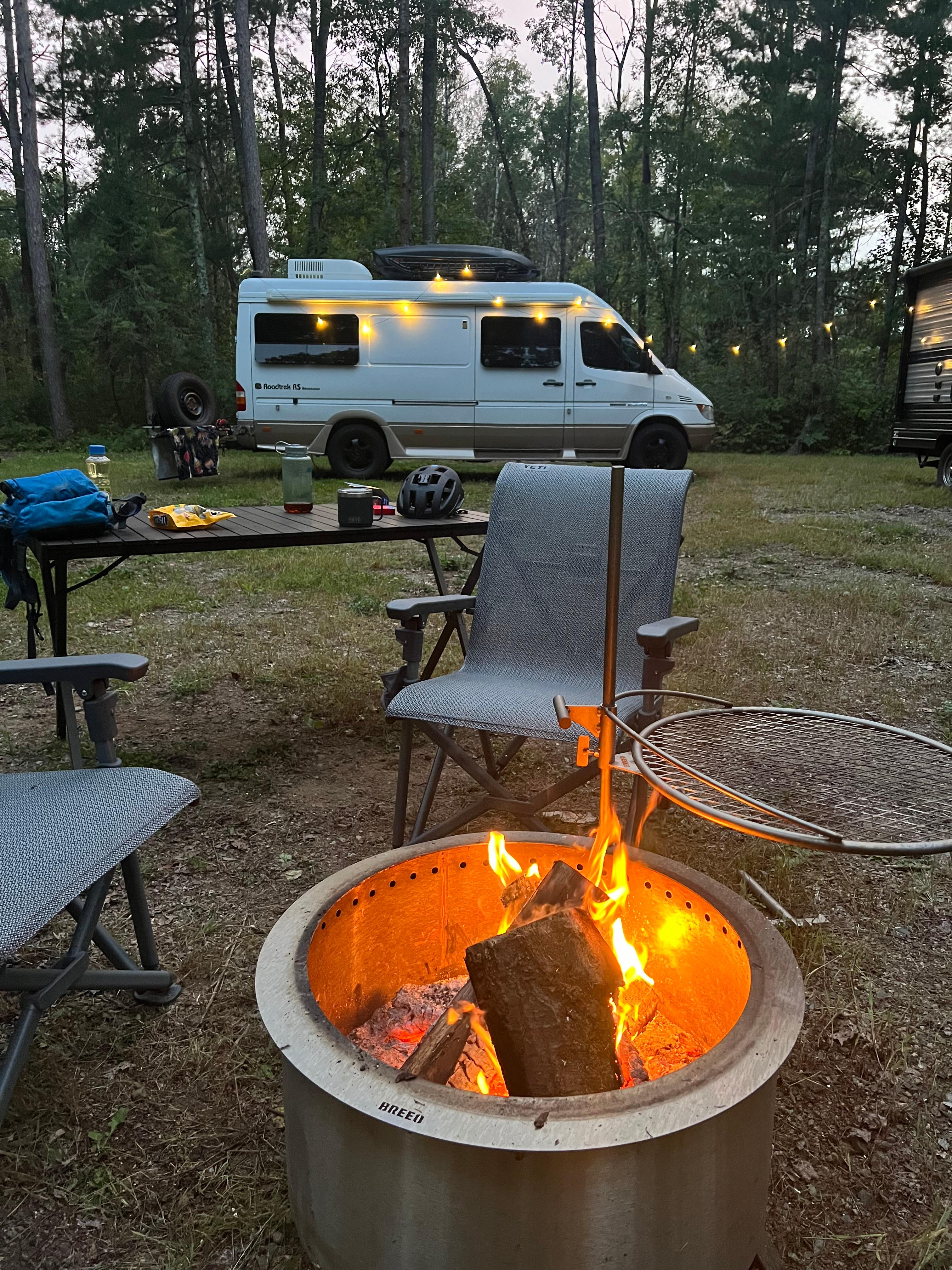 The site has a fire pit with grate. 