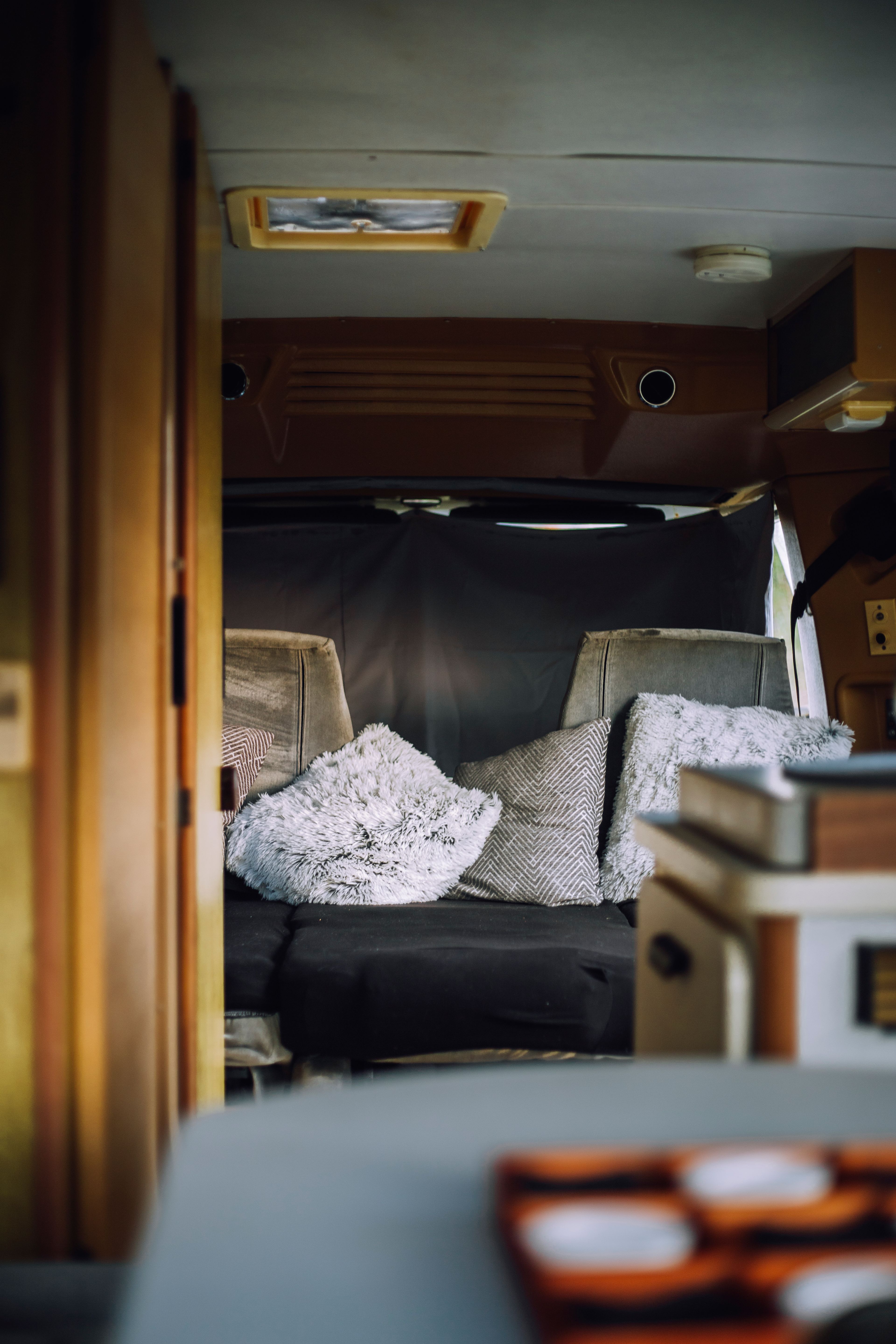 Minnie's front seats are folded down into a bed.