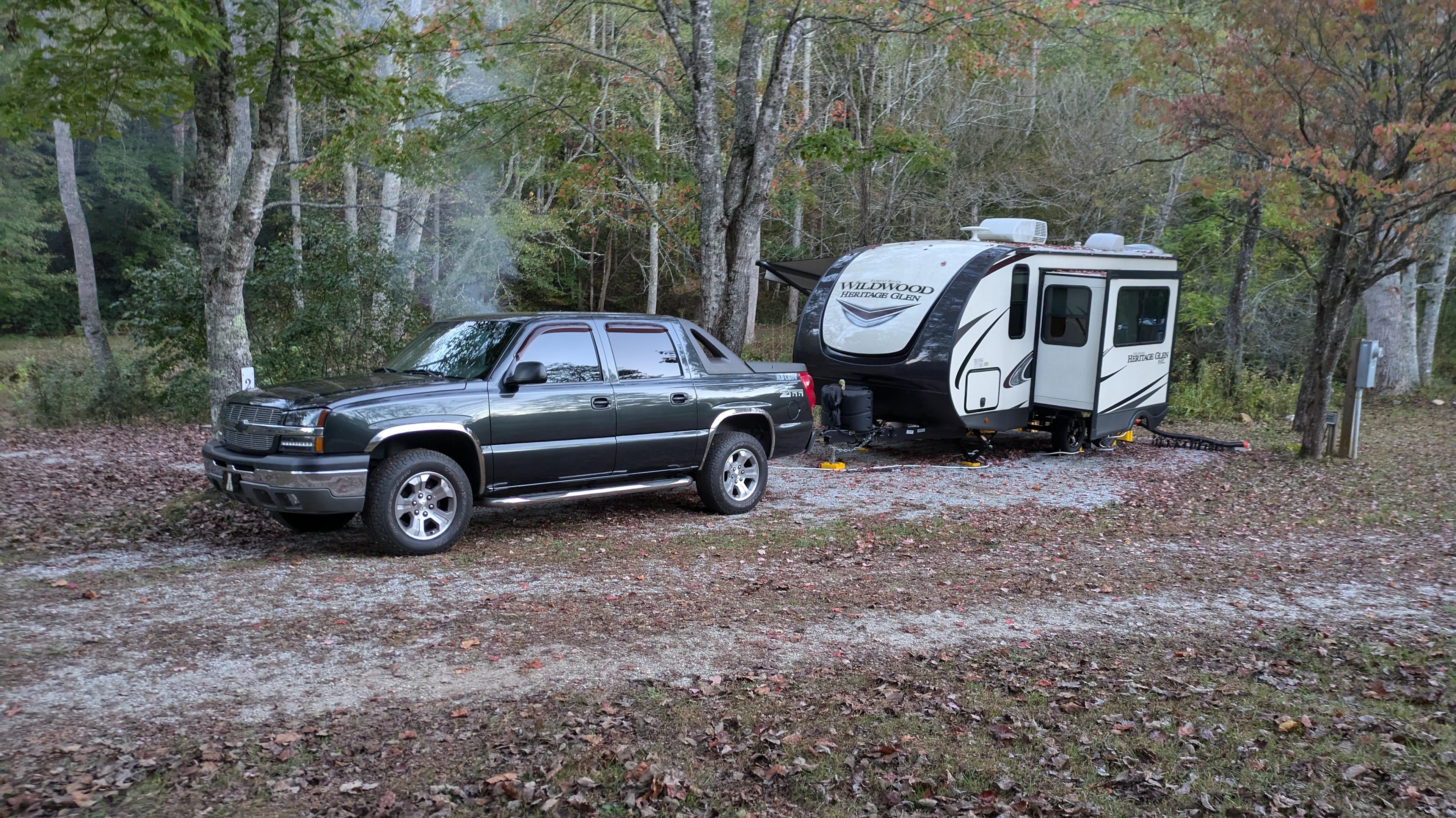 Gravel pad...but all good. Bring an extra hose for fresh water. 