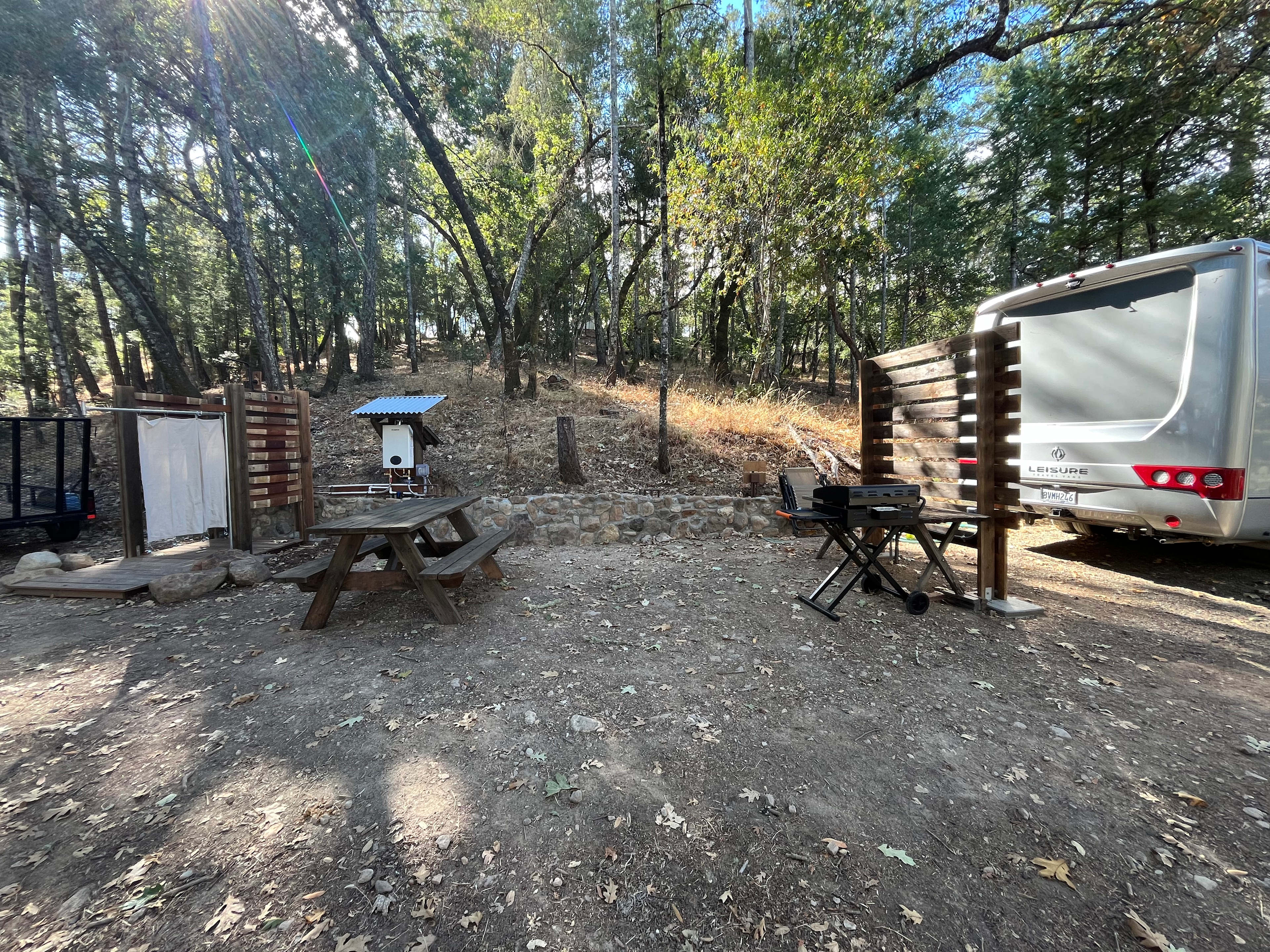 The camp. Shower, picnic table, Propane, BBQ/griddle, RV parking.
