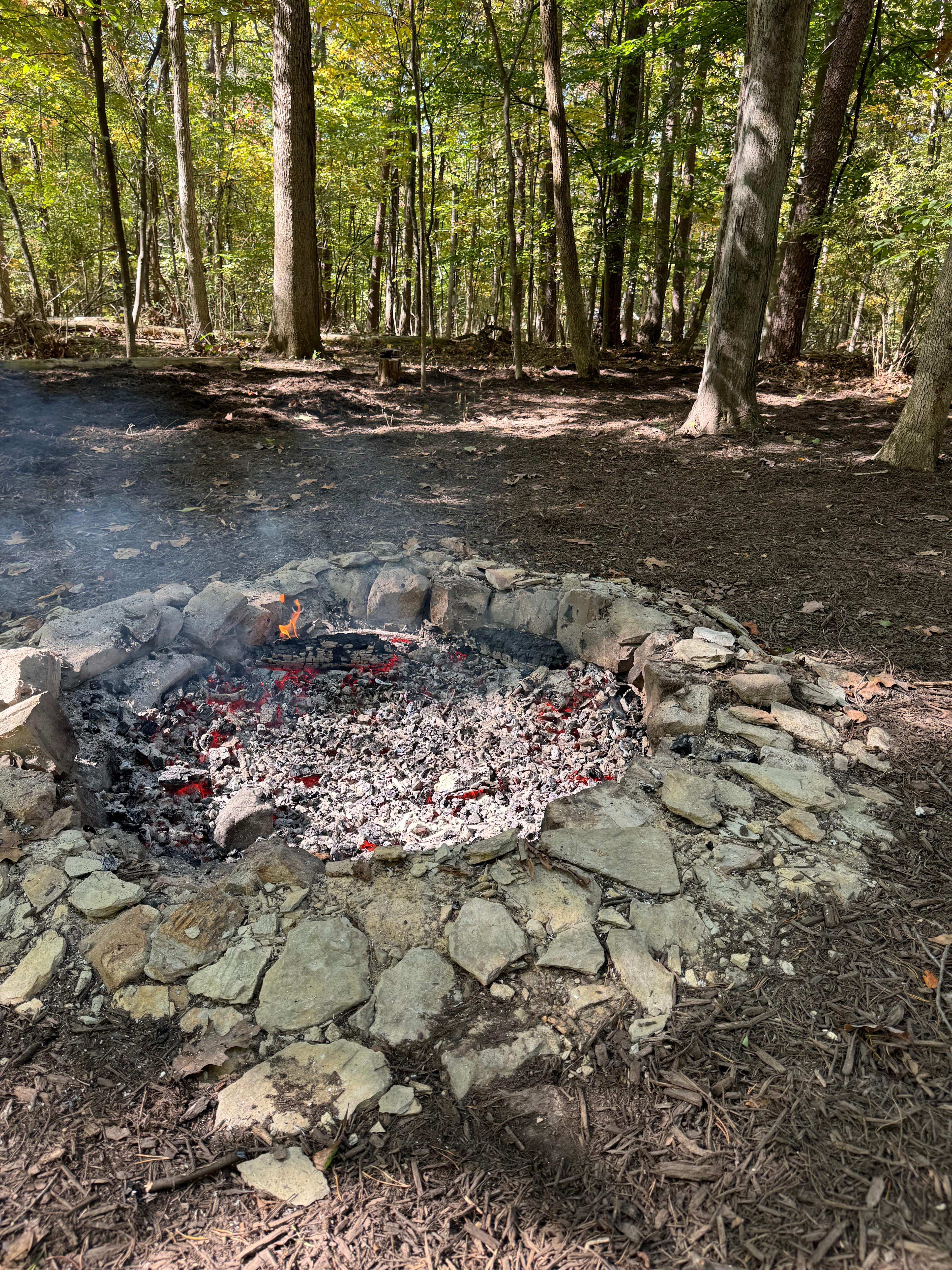 Fire pit is 4ft wide and 1foot deep with stone hearth. 