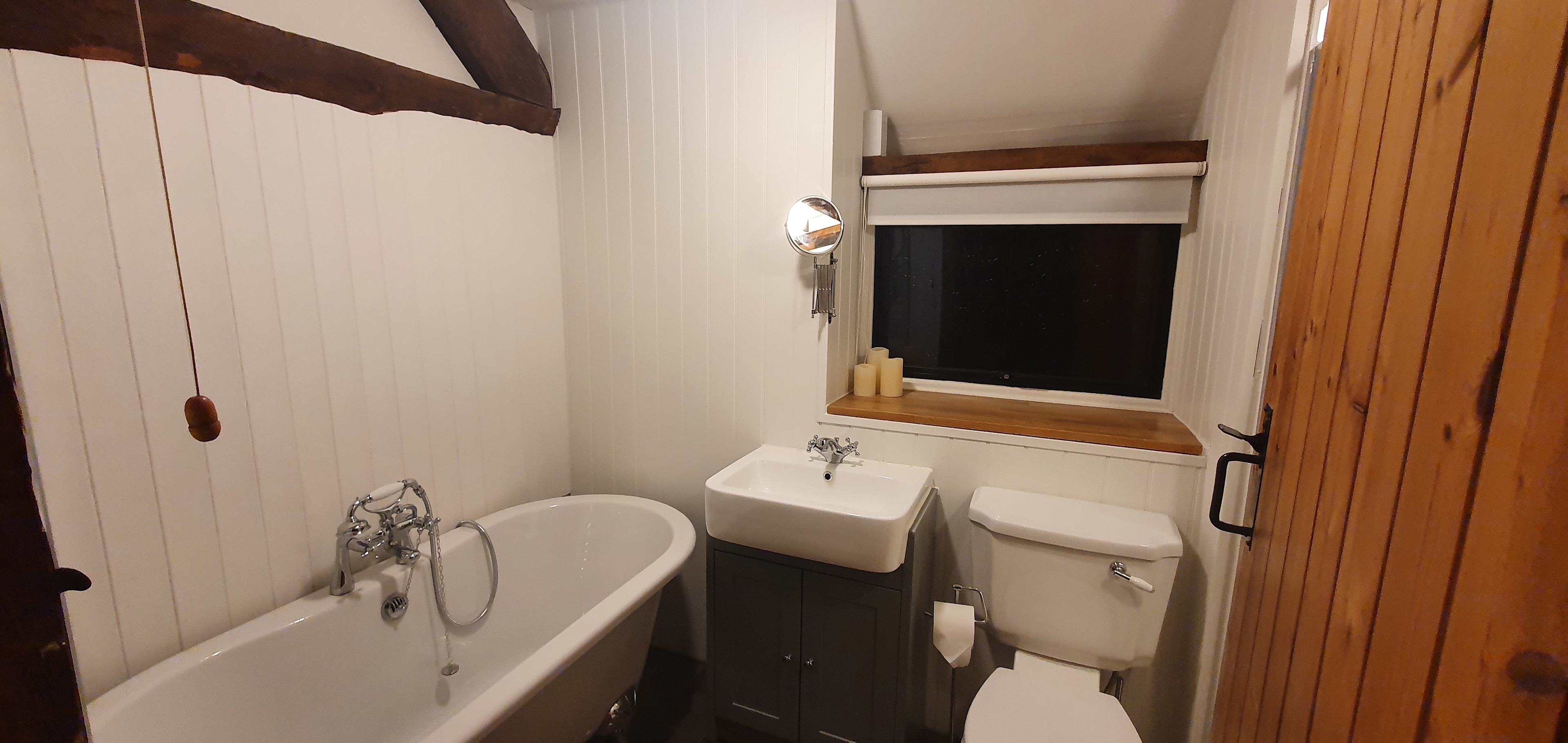 Roll top bath and walk in shower.