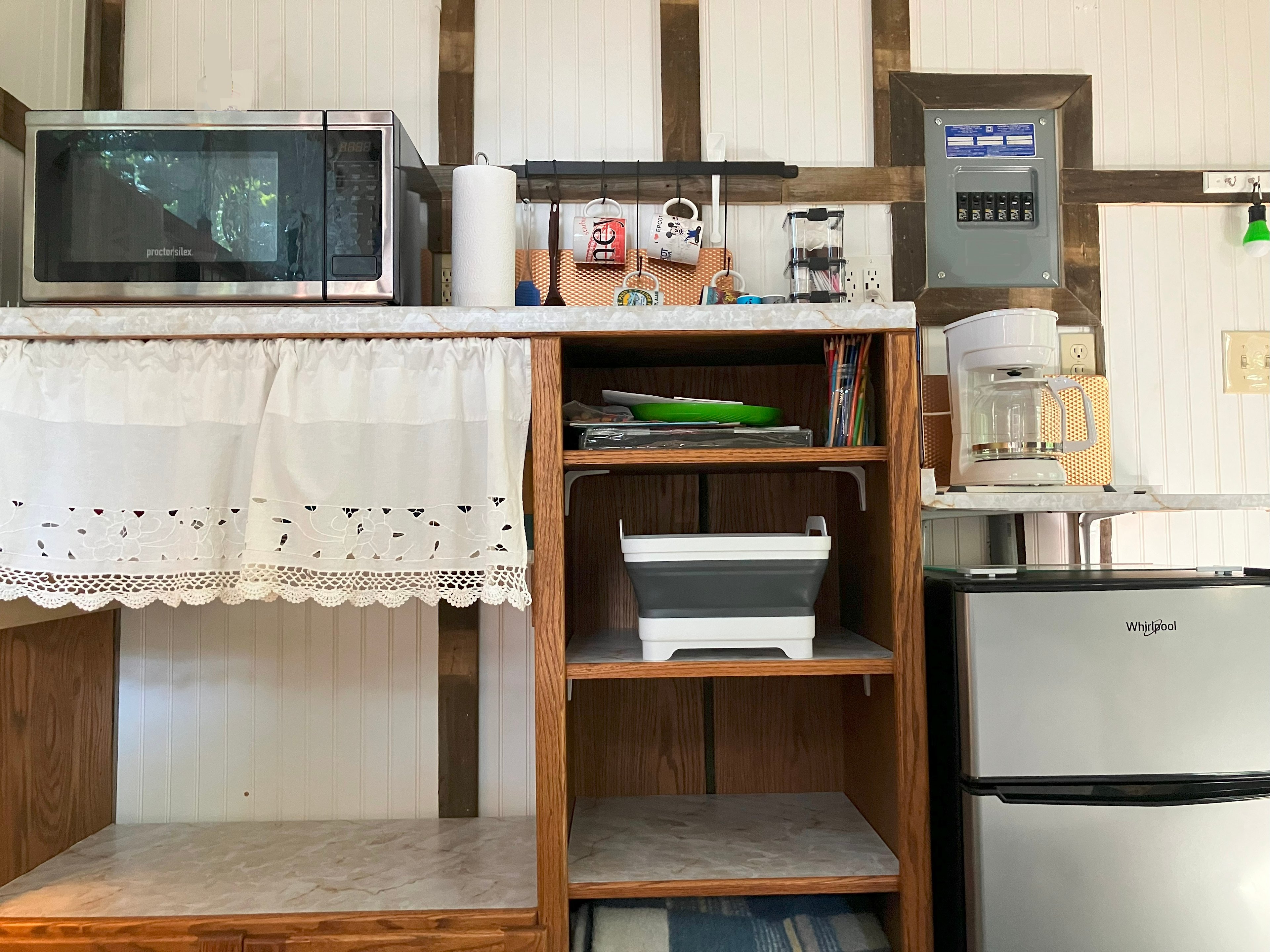 Kitchen area is fully stocked with dishes, pots, silverware.
Coffee Pot, coffee, sugar, creamer, Tea Bags included.
Microwave and Mini-Fridge w Freezer included.
5 gal. Drinking Water included.

Bring your own Food. 