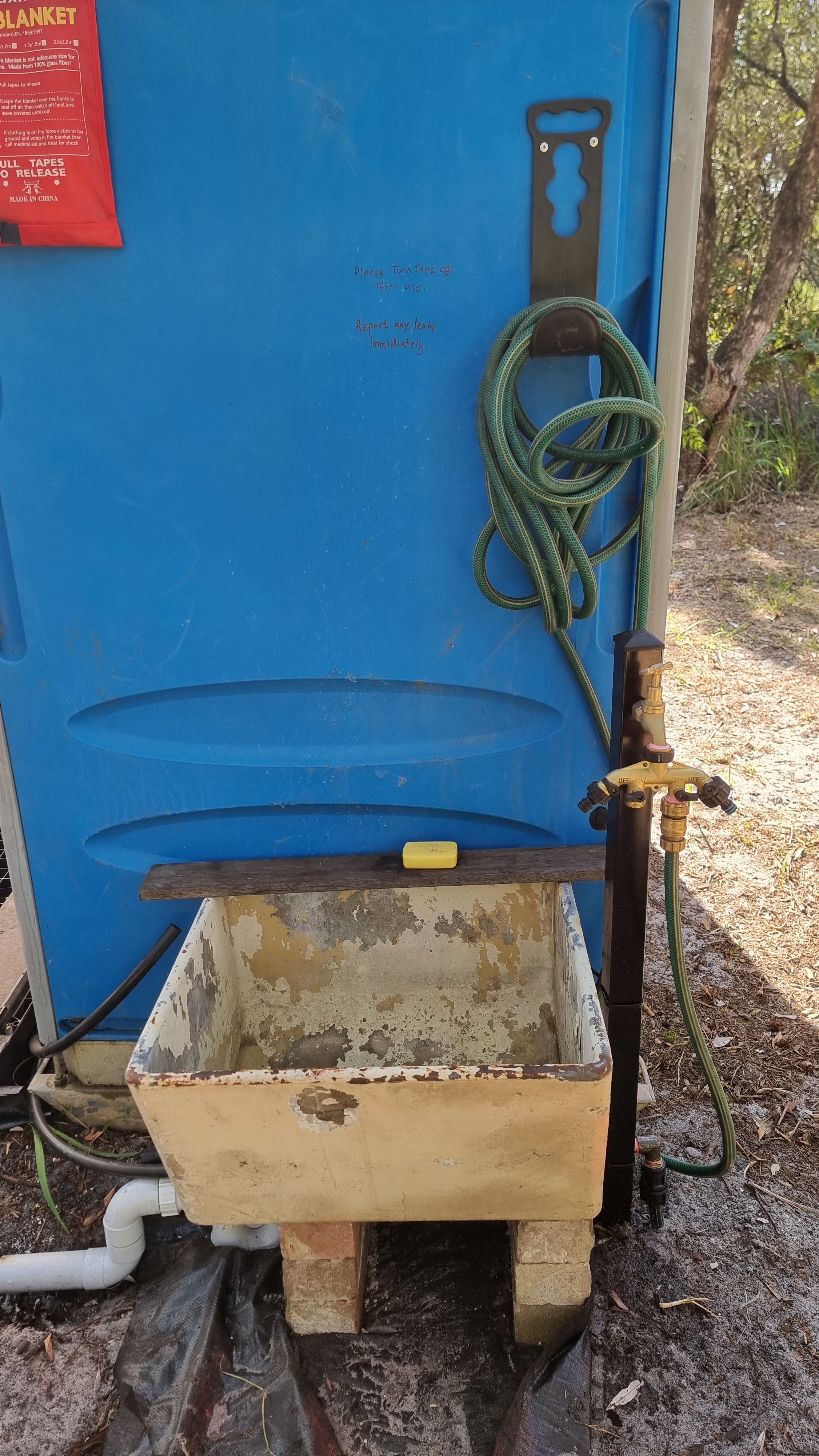Rustic concrete sinks with garden tap and hose, with town mains potable drinking water. 