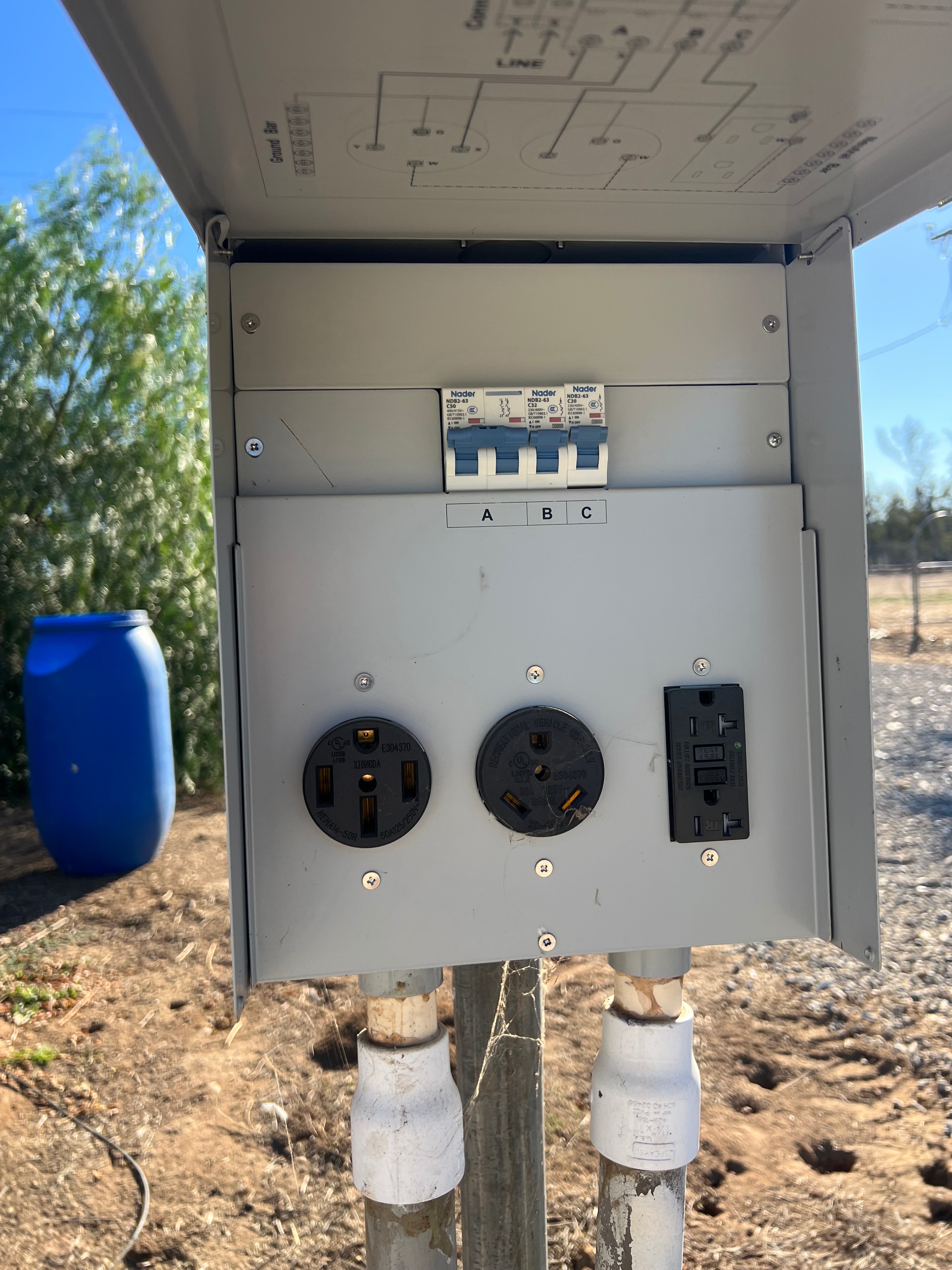 close up of top of the hookup pole, 50amp, 30amp, 110v electrical connections