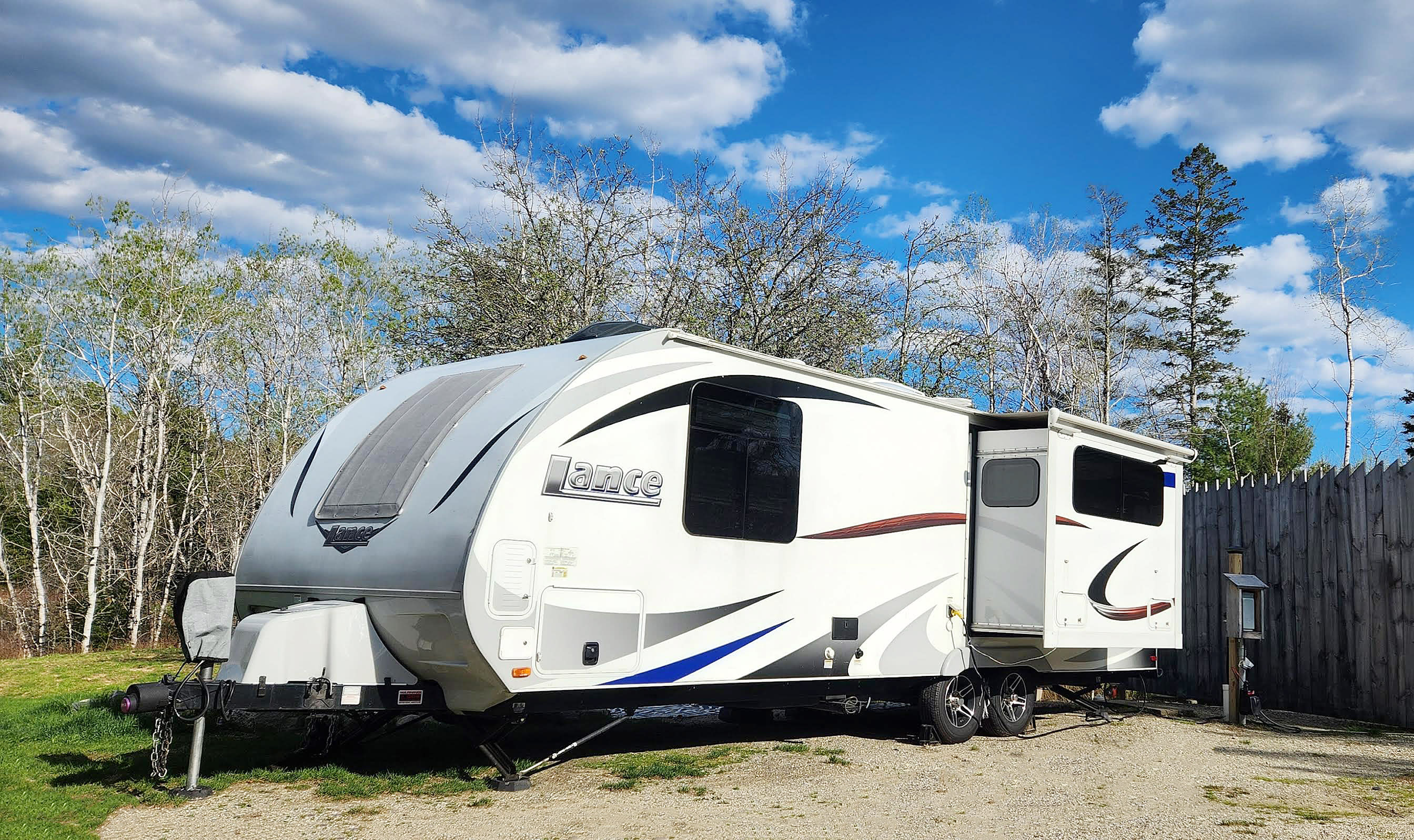 A camper sits on the pad at Ellie's RV spot.