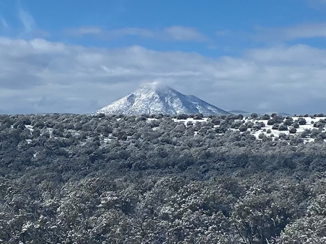 Picacho Butte elev. 7,168. 
approx. 6 miles away.
Peakbagger.com info. 
https://www.peakbagger.com/peak.aspx?pid=3934