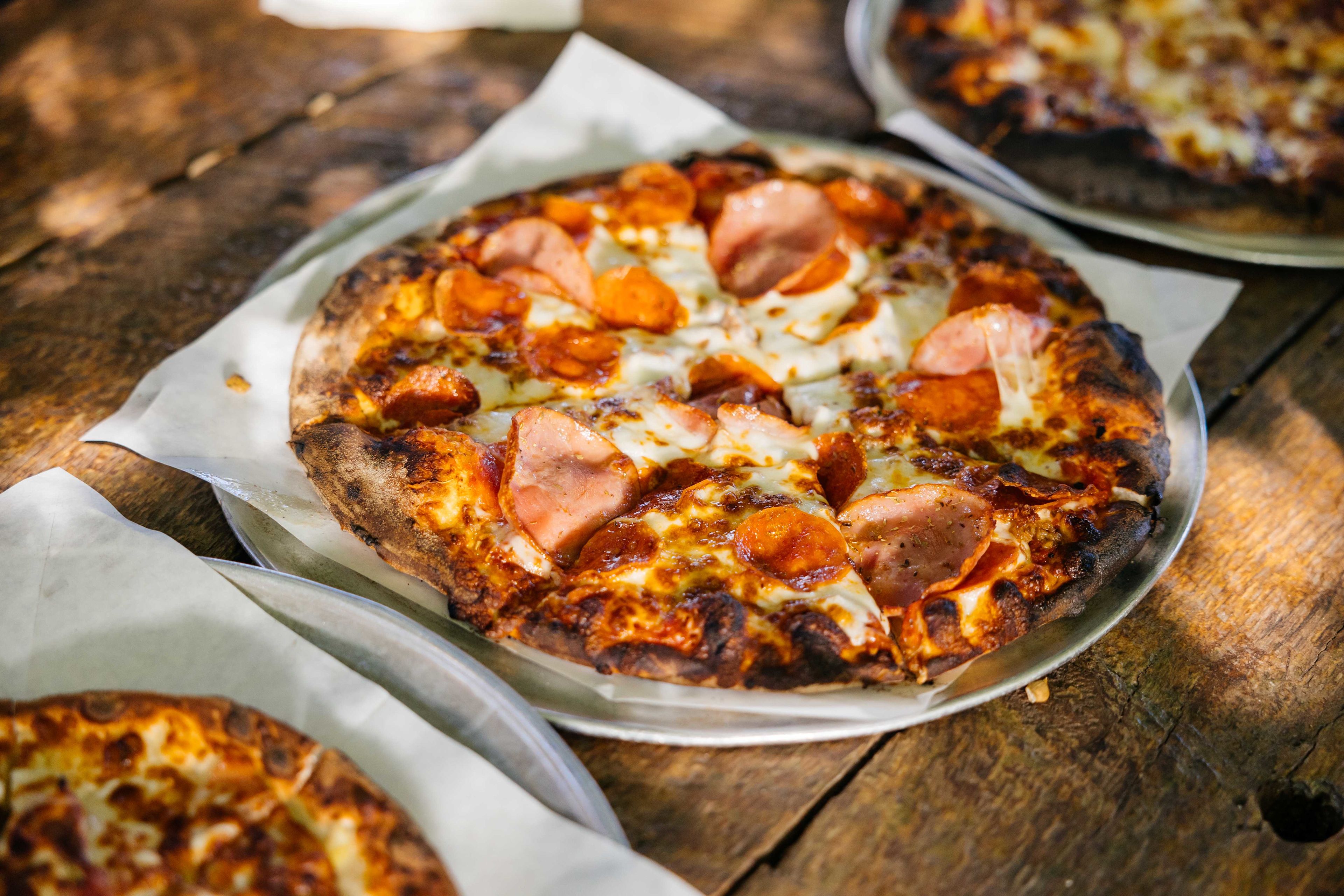 Wood-fired pizzas available on open-to-the-public nights, pre-reserve crusts on our website.