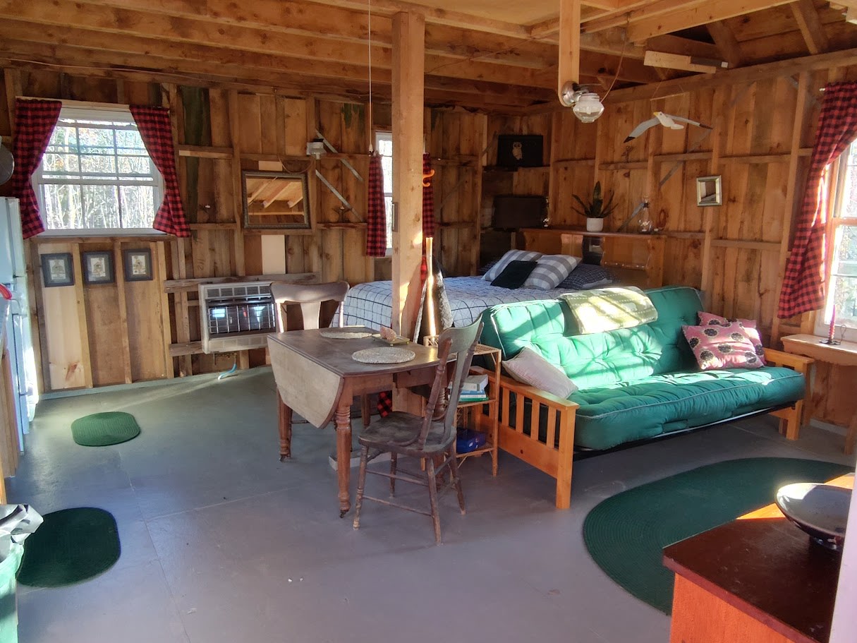 Living area and bed area.  Futon can fold out to full size sleeping unit