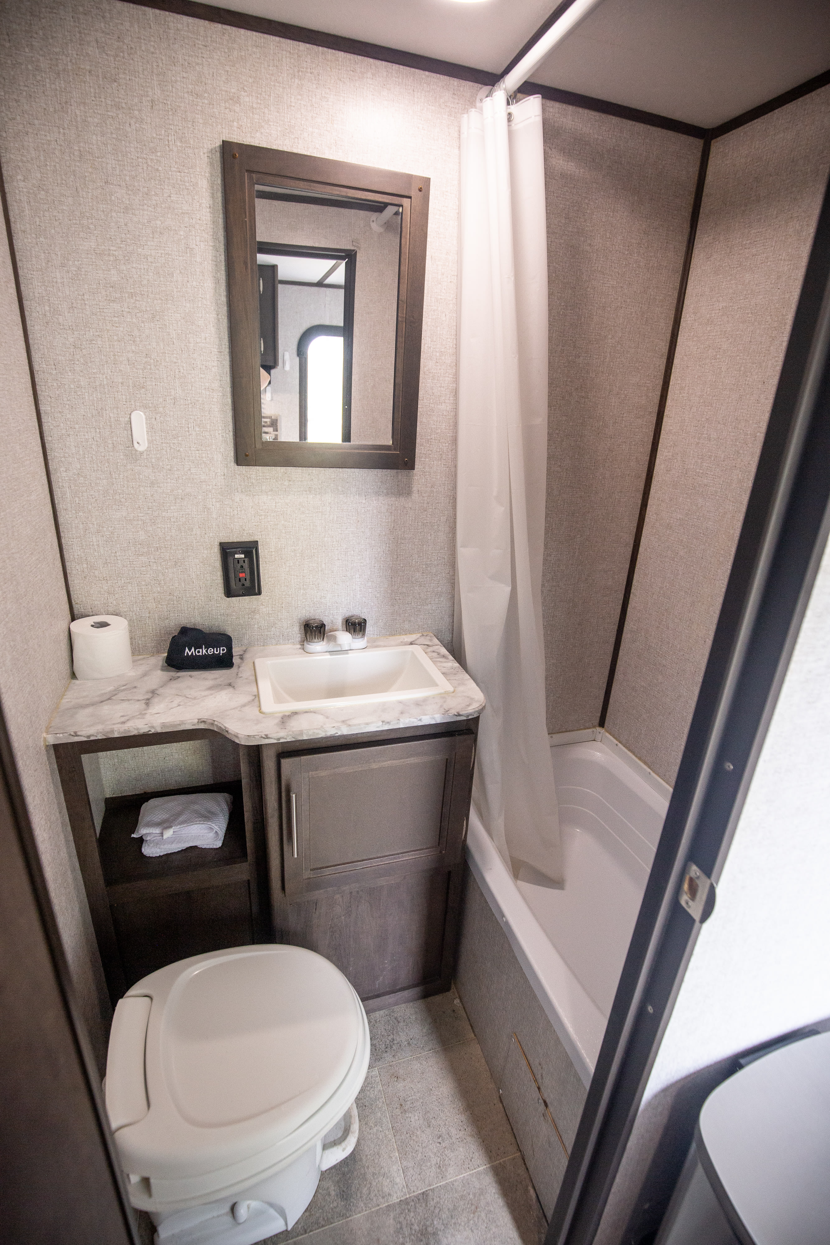 This private bathroom has hot and cold water, towels, and hand soap.