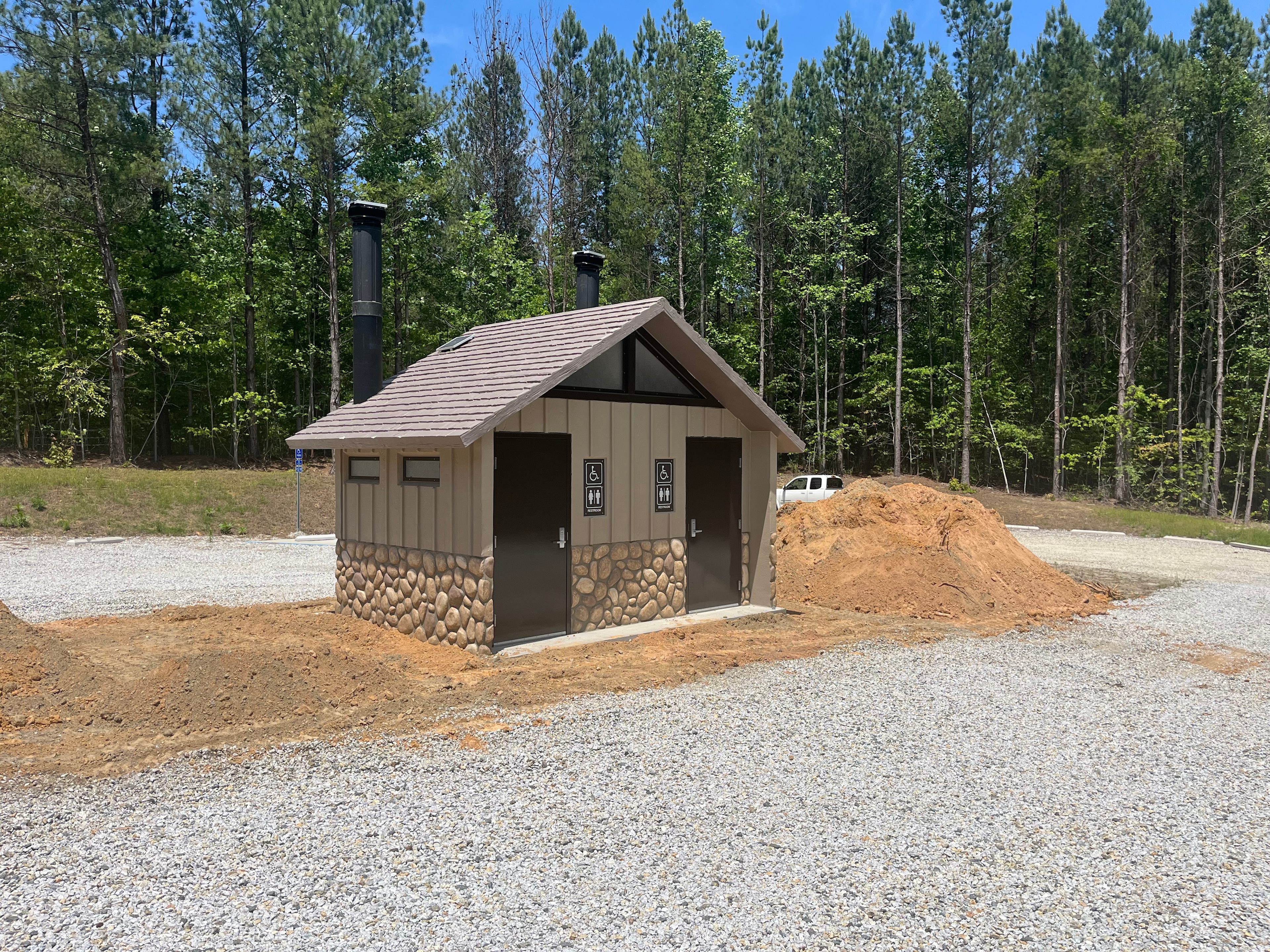 This bathroom is at the Stumphouse MTB Park upper parking lot. Which is .6 miles back Ross Mtn Rd