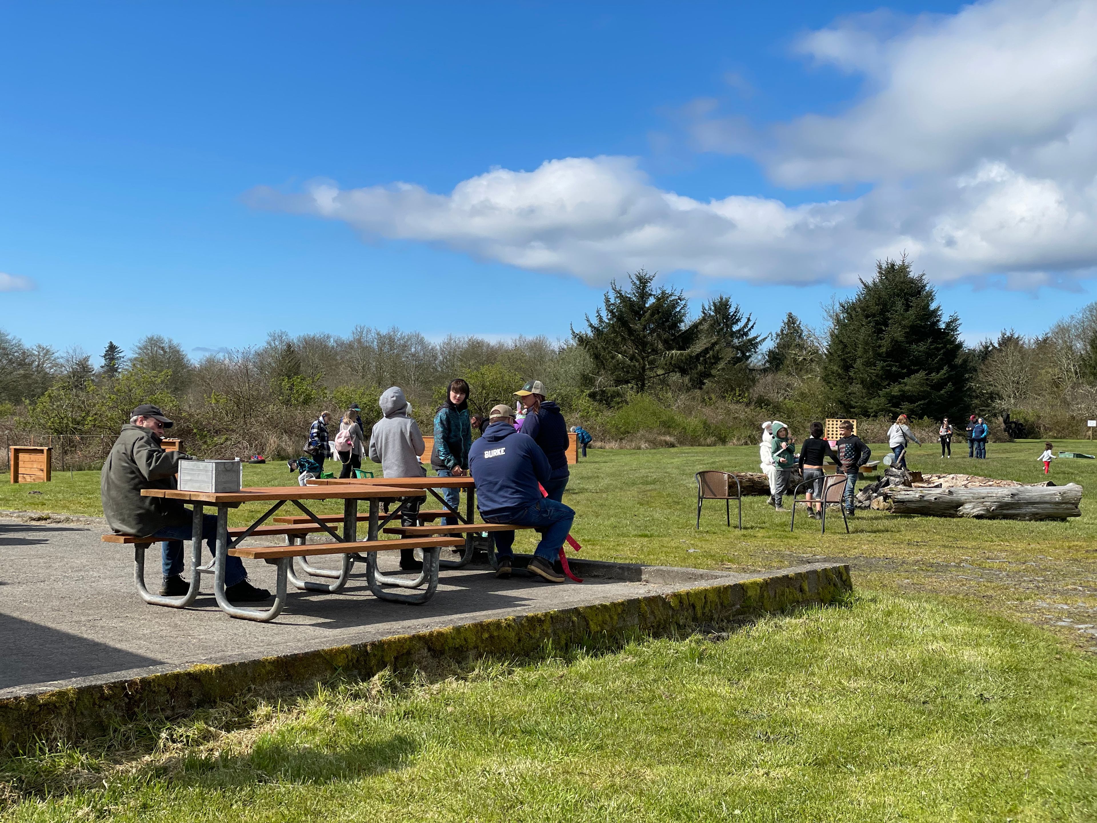 This photo was at a Rhett's Ranch Easter Egg Hunt. Concrete behind the barn. Fire pit directly behind and Horseshoe pits to the left.