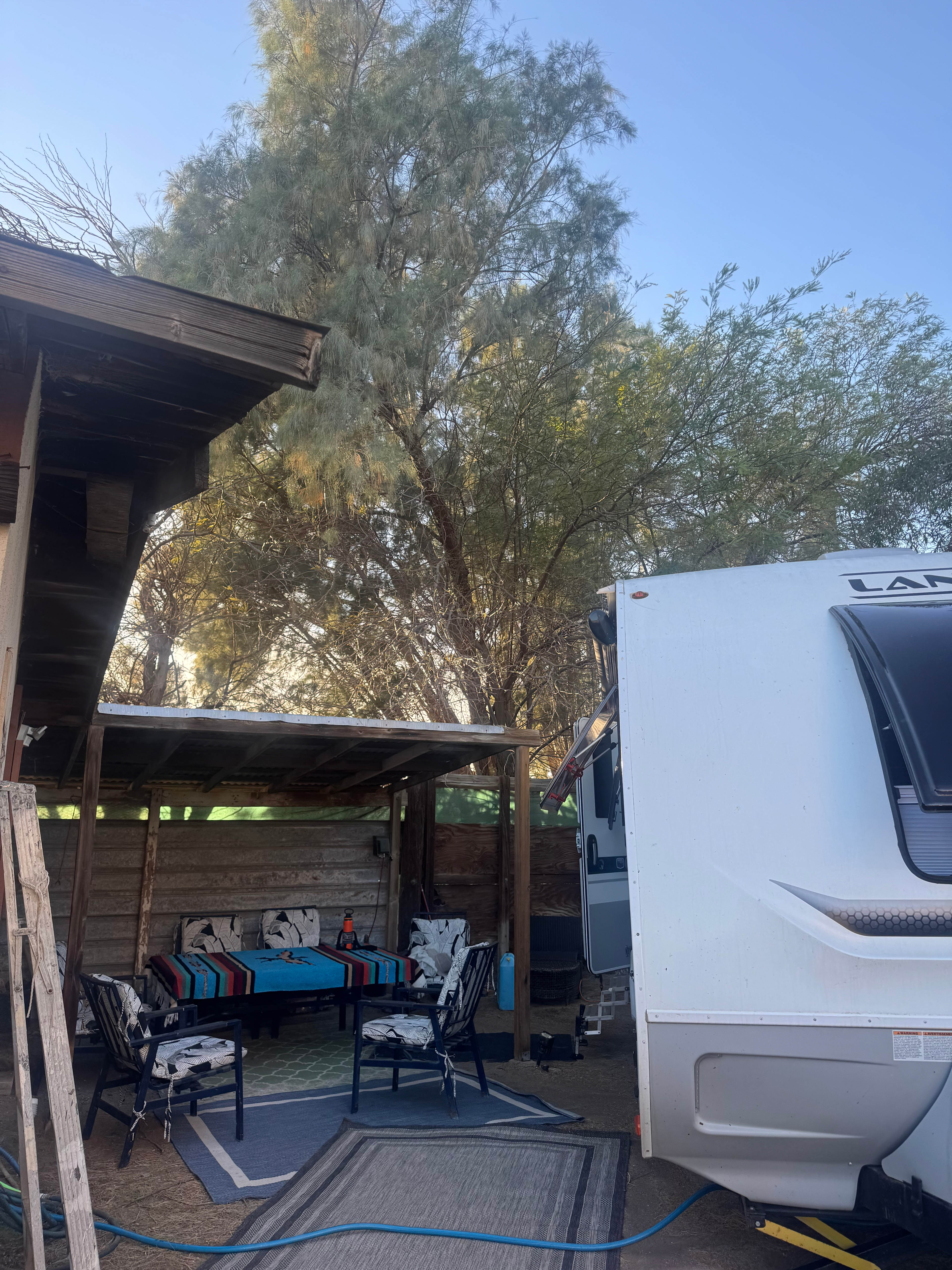 Protected shade structure and dining table