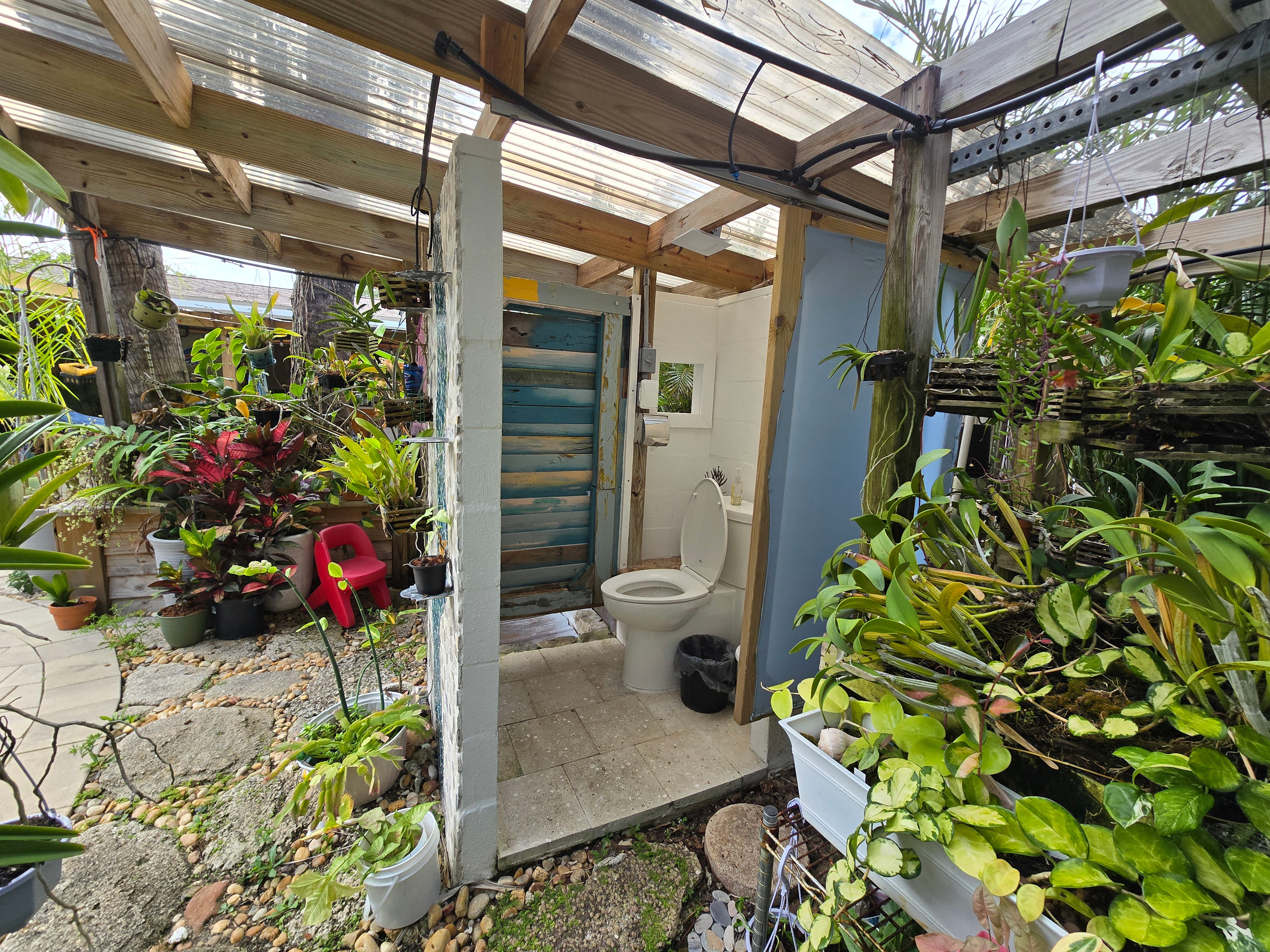 Bathhouse w/flush toilet - paper products, sanitary napkins and wipes disposed in wastebasket please. 