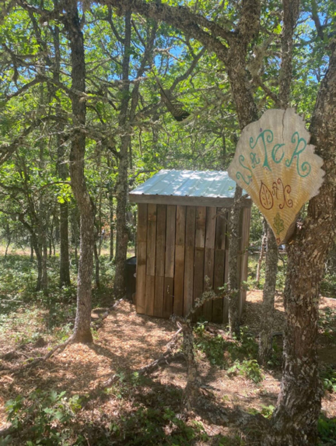The WaterOak campsite outhouse - a simple yet practical composting toilet set up .. aka the "Poo-goda"