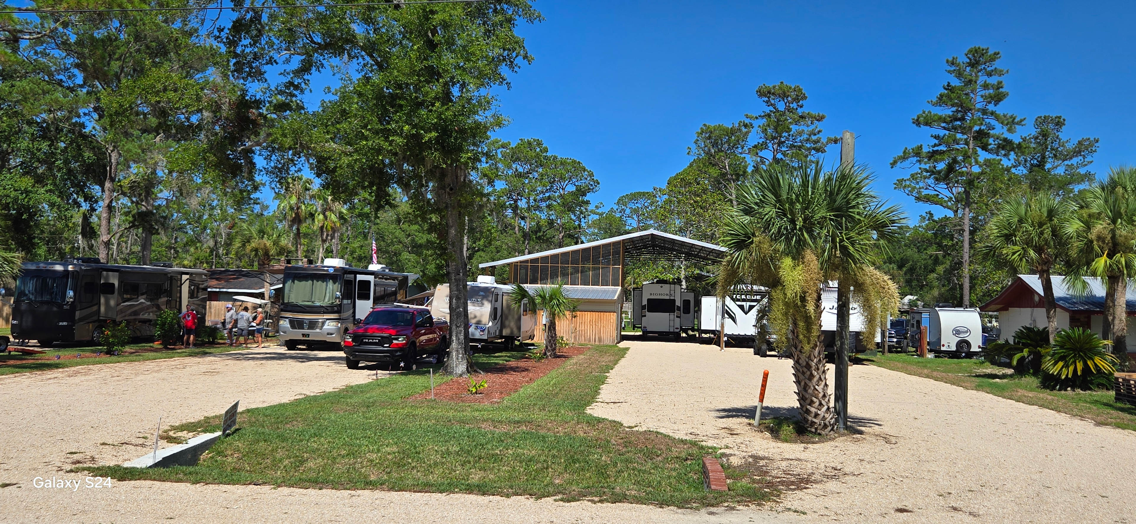 Currently have 3 polebarn spots next to 2 bathrooms that include showers and 2 washers and dryers.  Above the washhouse is a screened in porch.