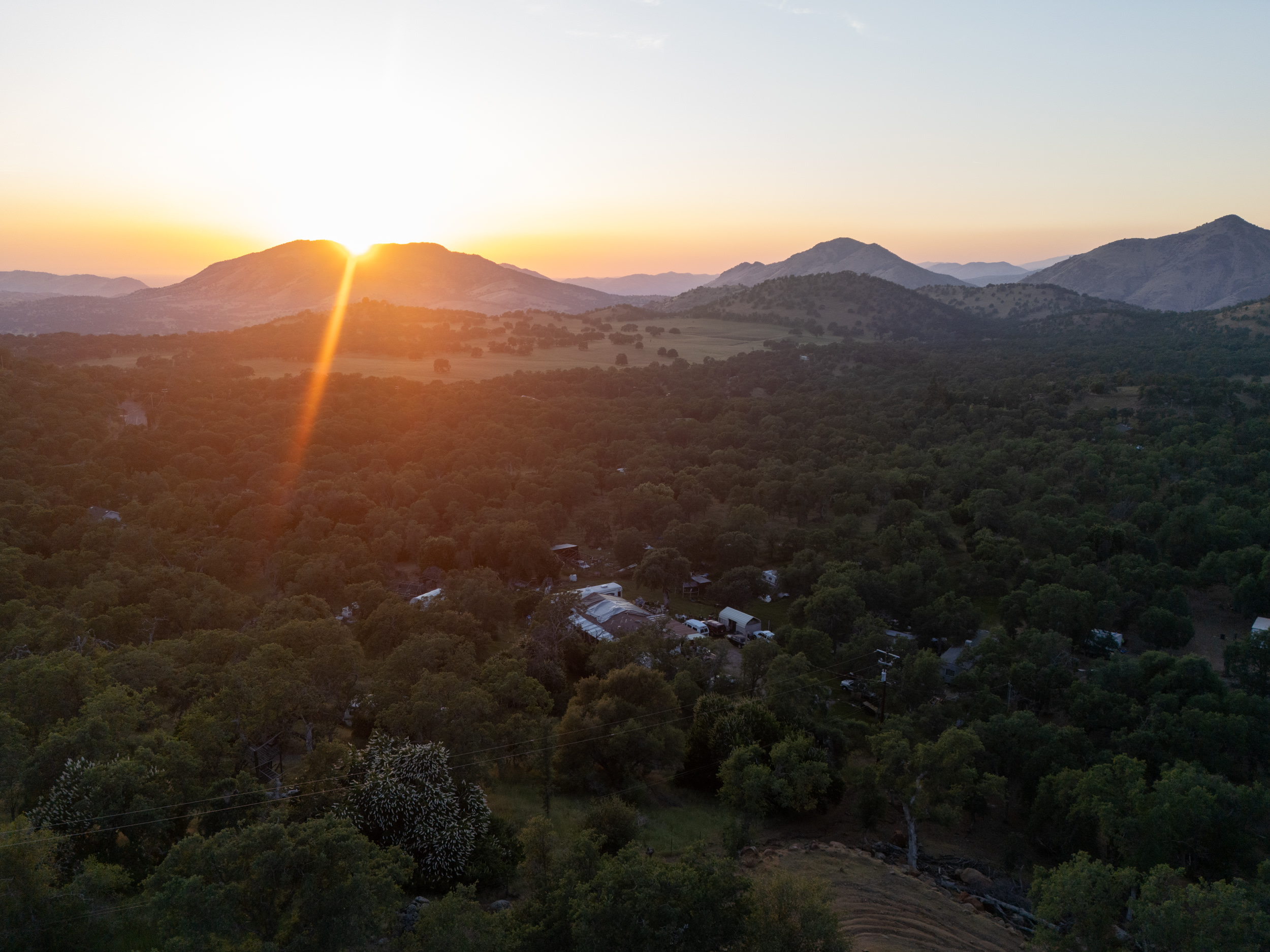 Sunset aerial view of the property