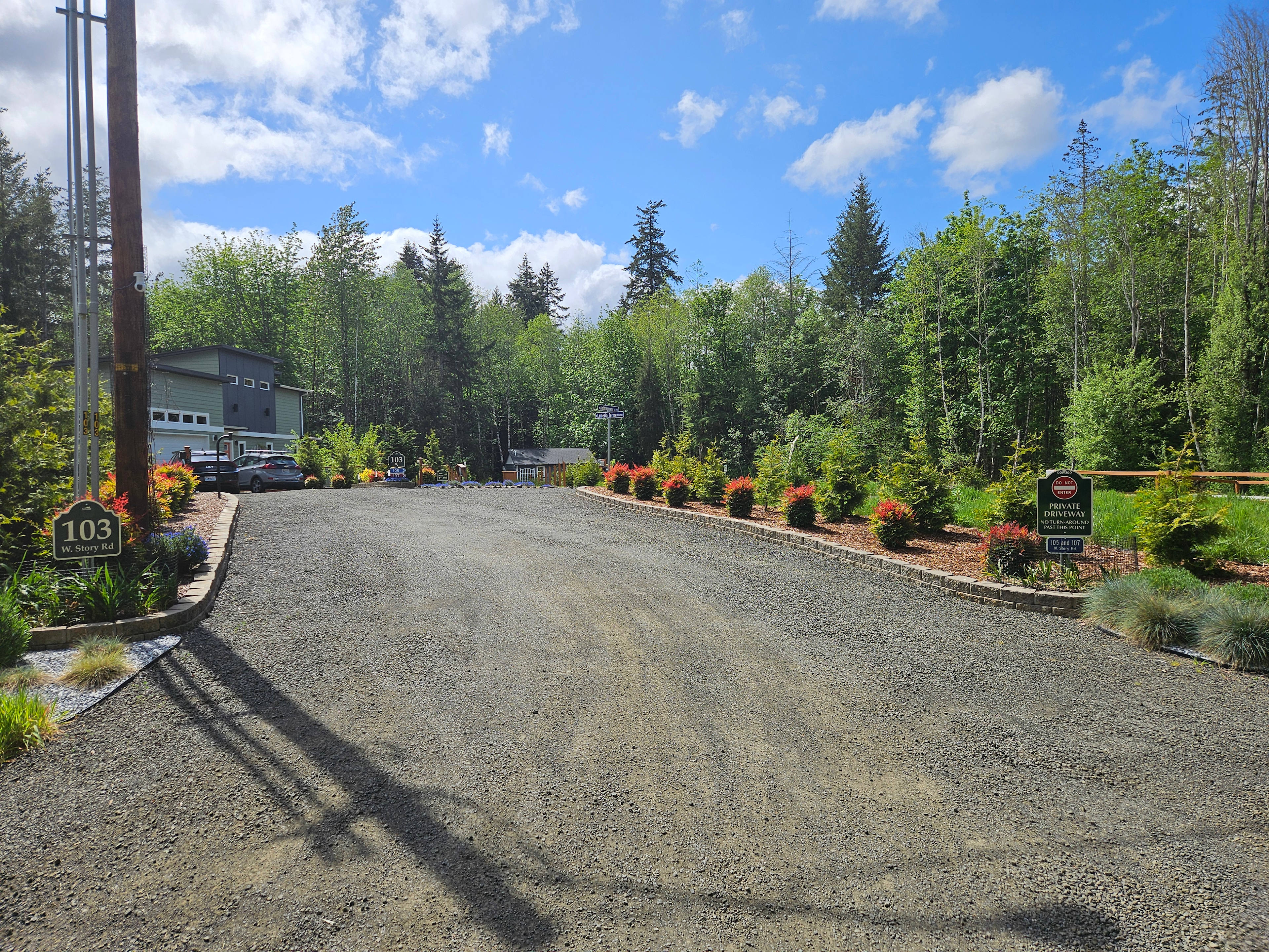 Driveway entrance is 22' wide -- nearly two freeway lanes.