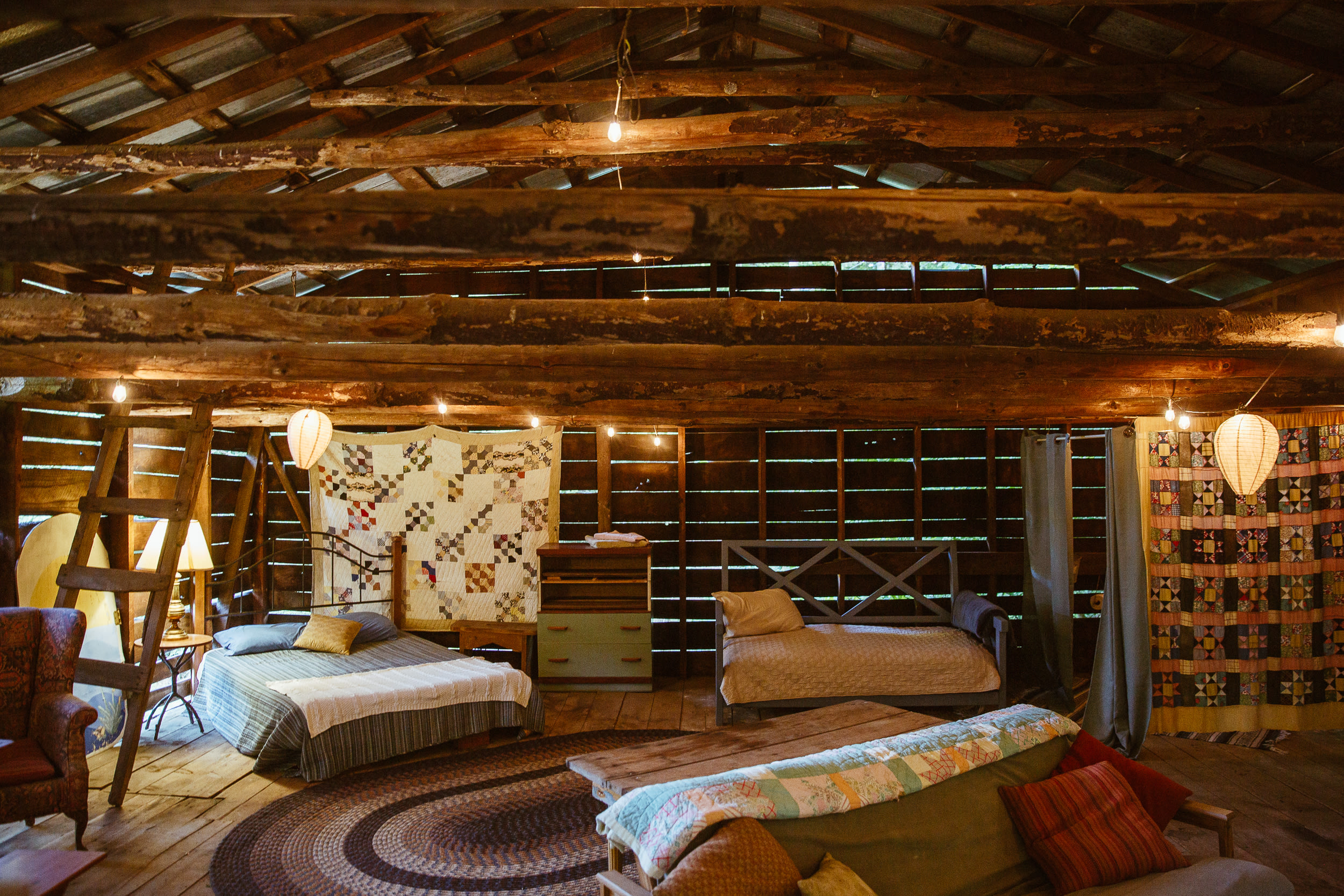 Bedroom area with 1 queen bed and 1 twin bed. Sofa also reclines into a queen bed.
