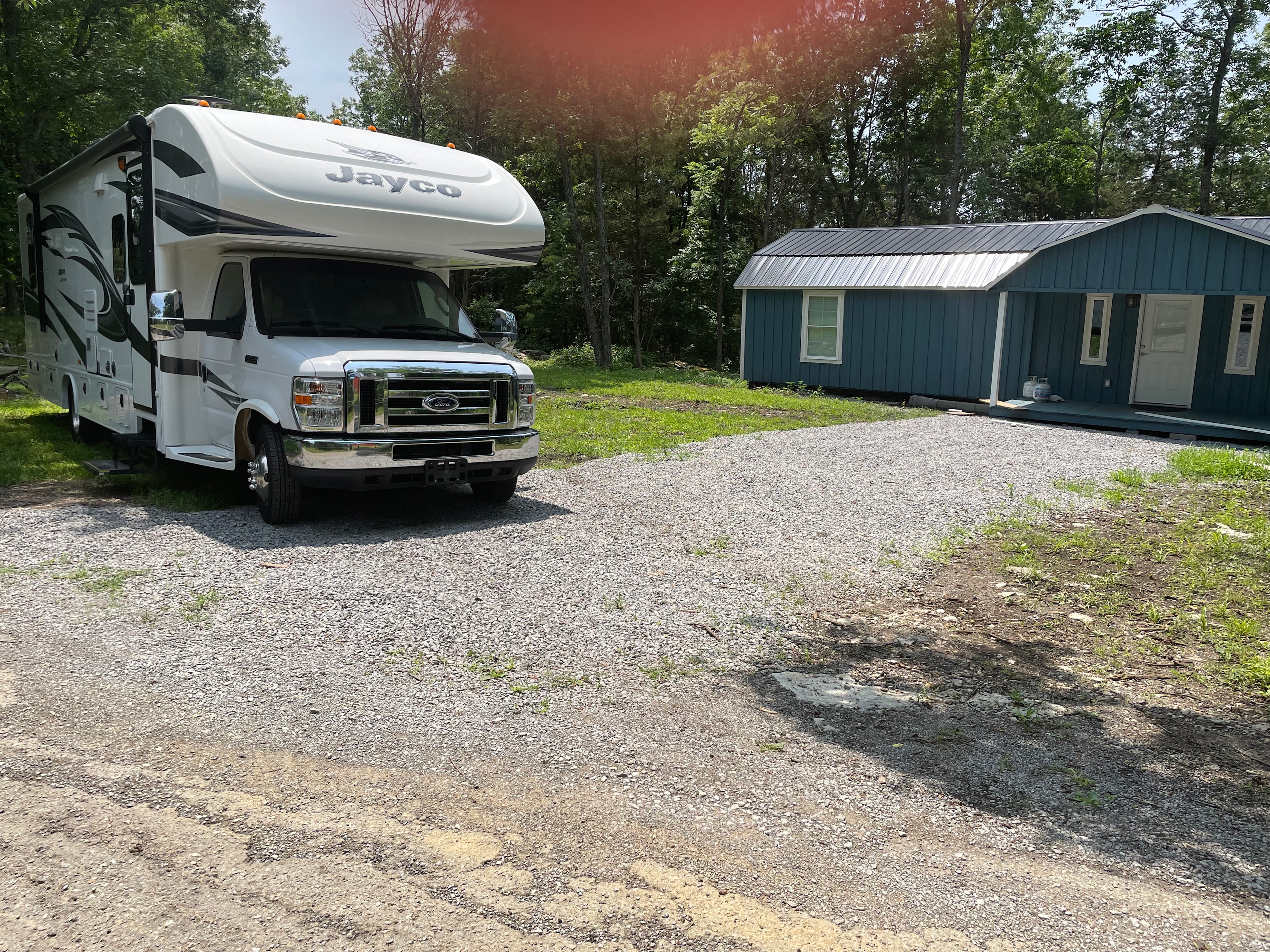 Rv is parked near one of our sometimes used lodges. When not in use the porch is yours to relax on 