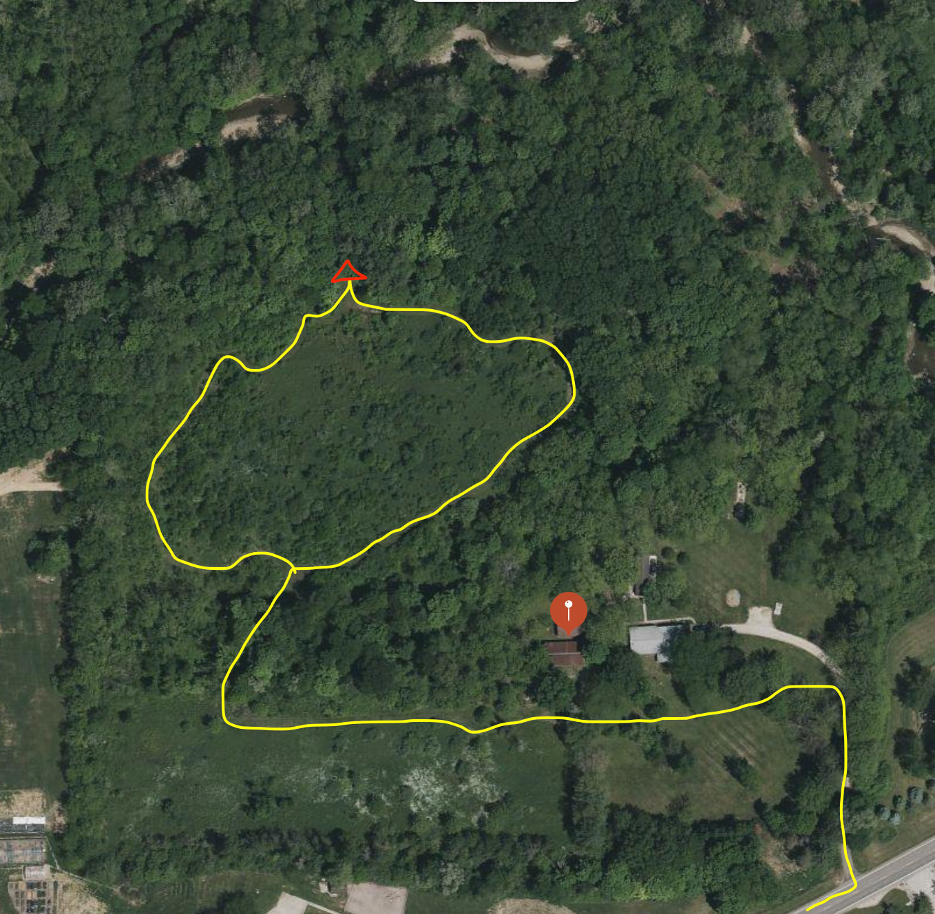 Follow yellow path to campsite. Take left off driveway into grass. Go past the house and barn. Trail starts just past the barn.