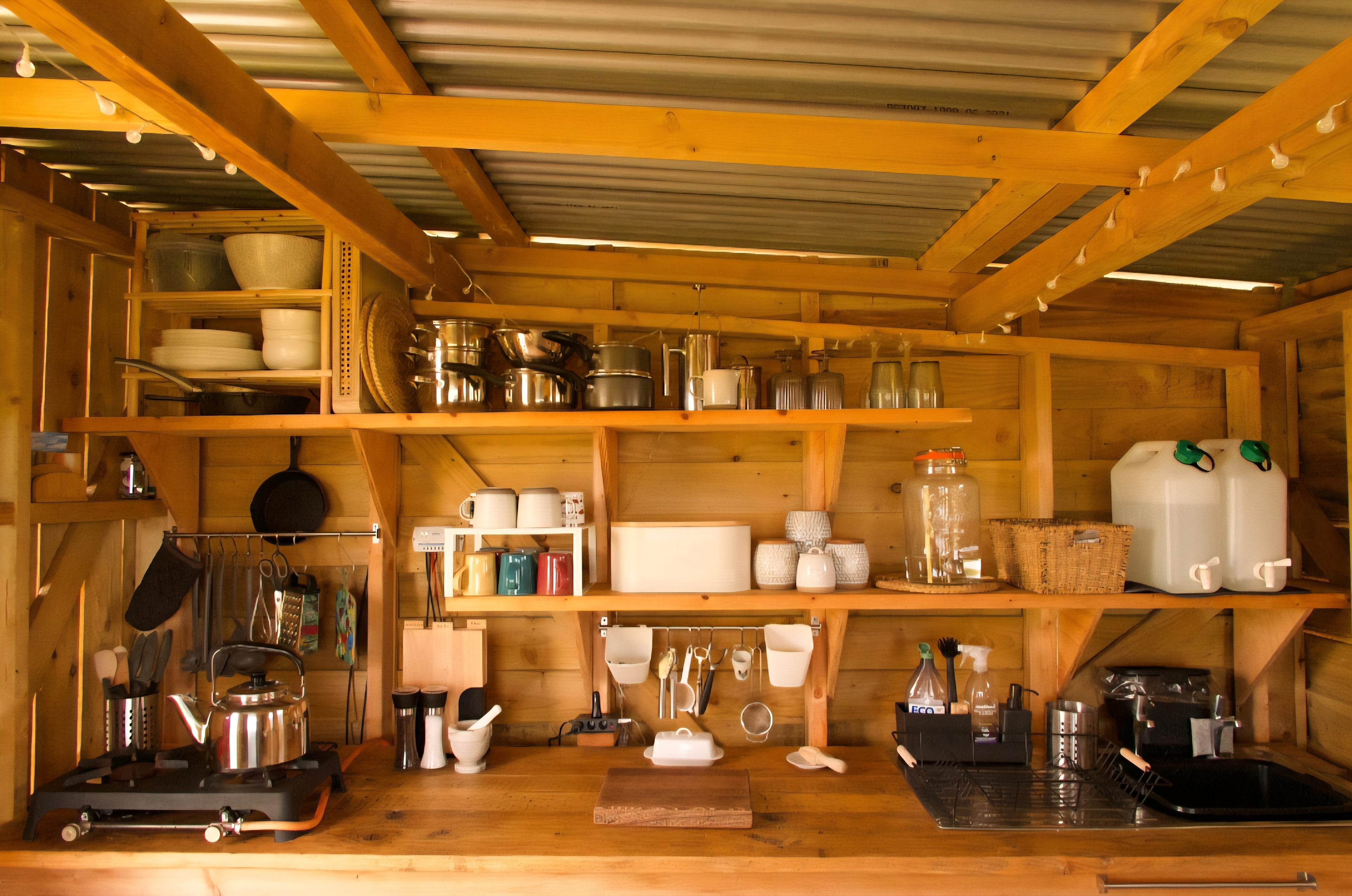 Fully equipped camp kitchen, includes a fridge