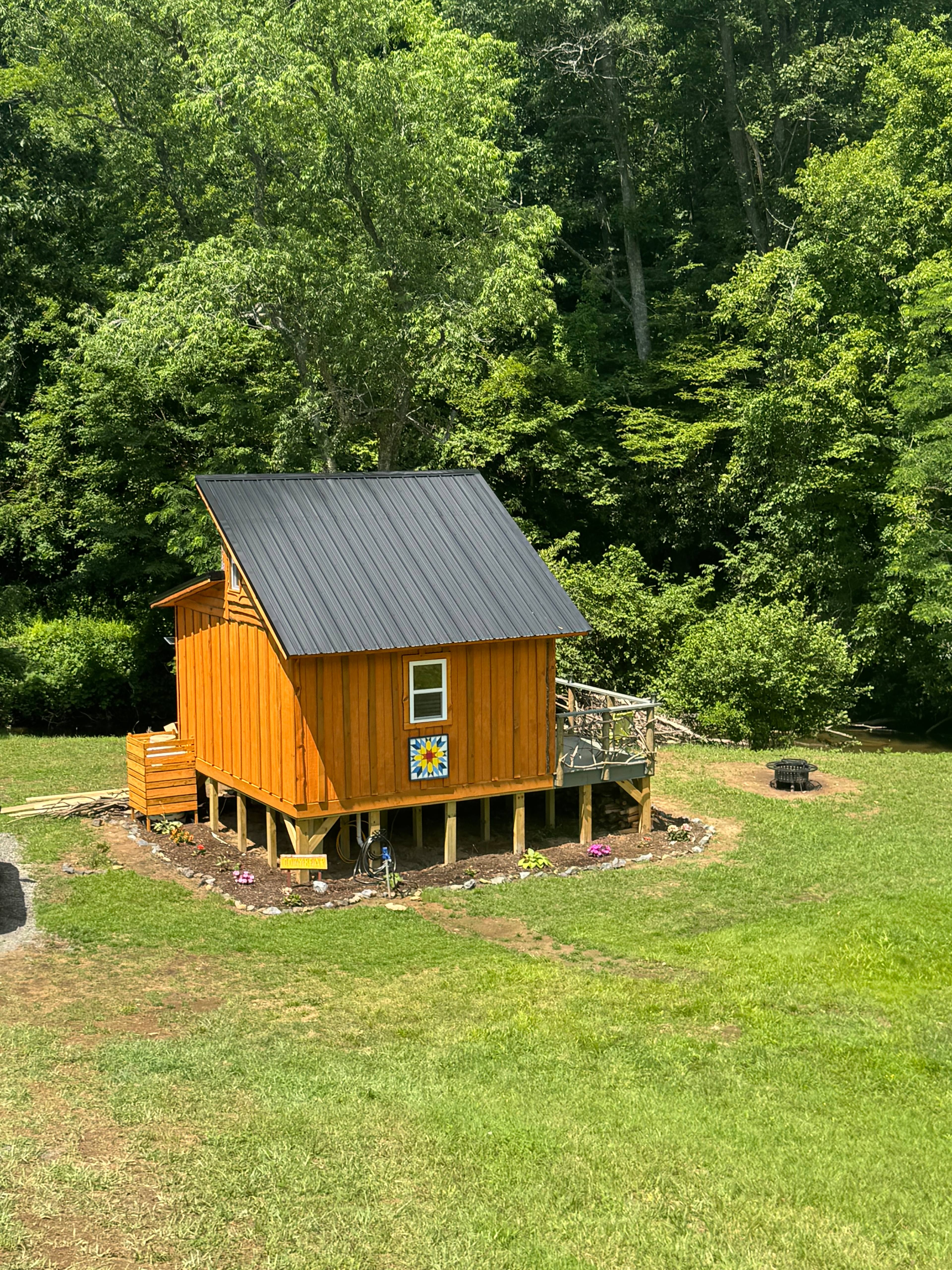The Cozy Bear, by the stocked creek