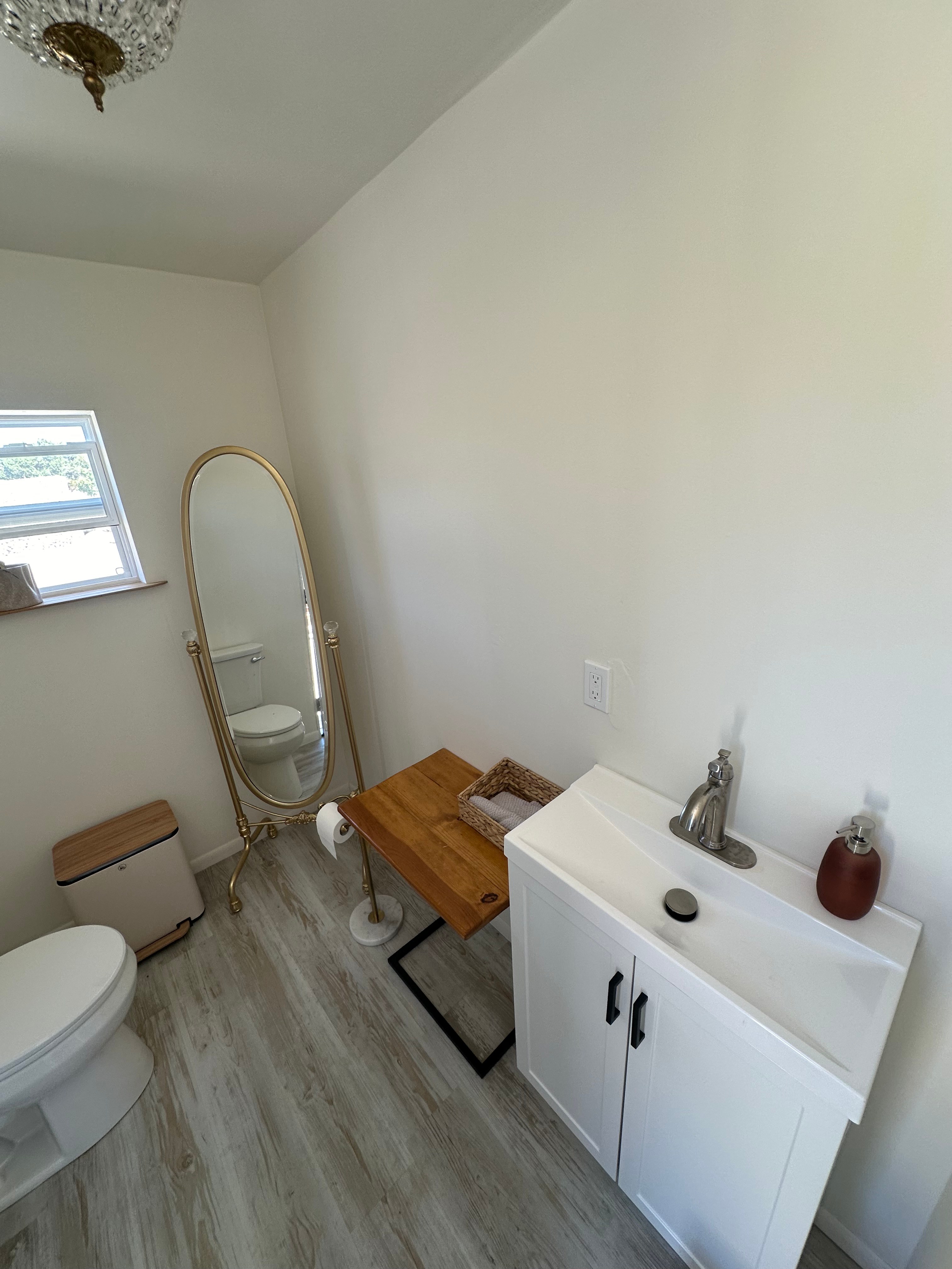Minimalist outdoor restroom with a clean white interior