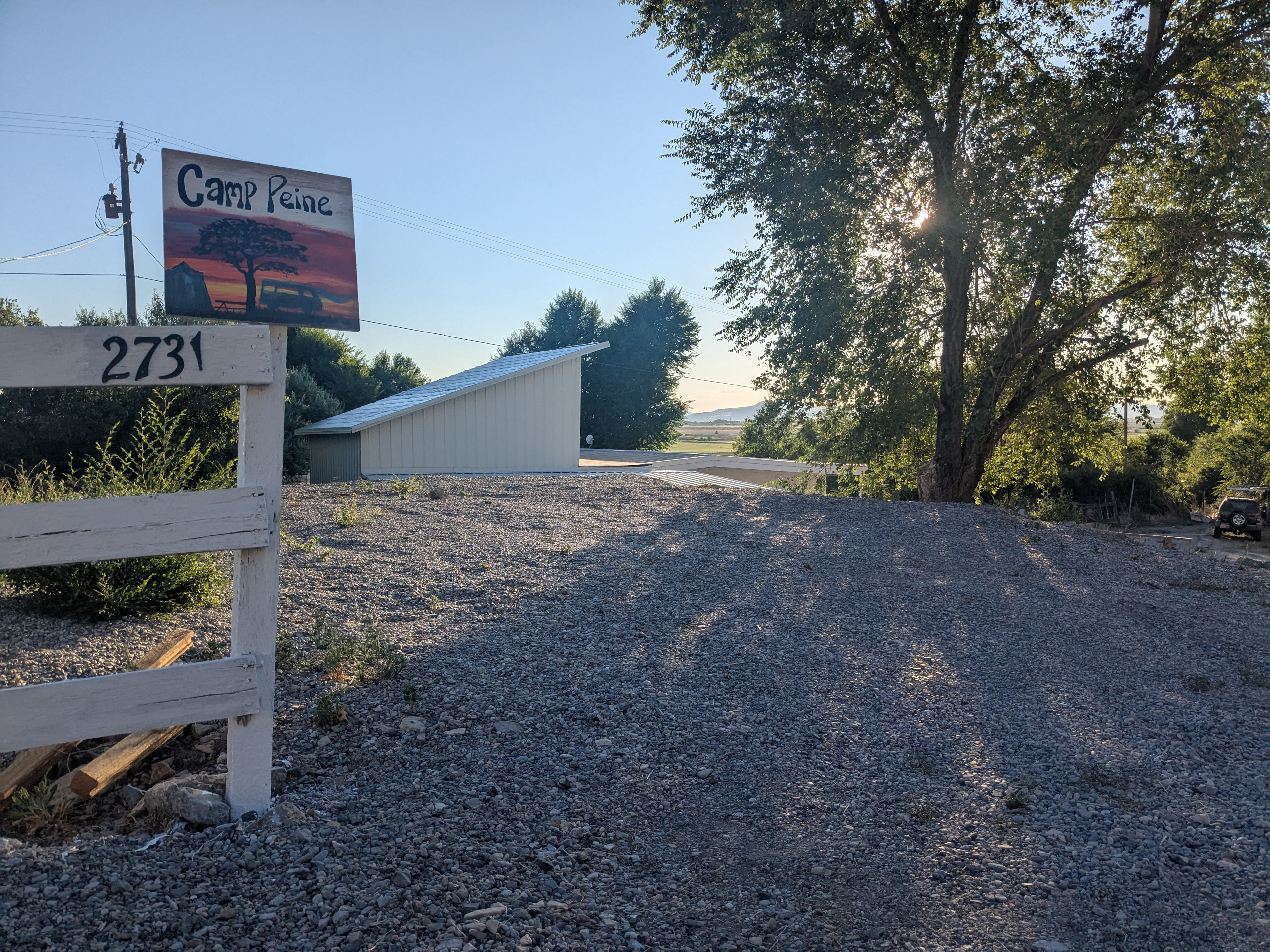 Welcome to Camp Peine!  We are a work in progress.  This is site #1, its a gravel, terraced parking spot, right off the highway.  There is a lone shade tree and a picnic table next to the spot.  