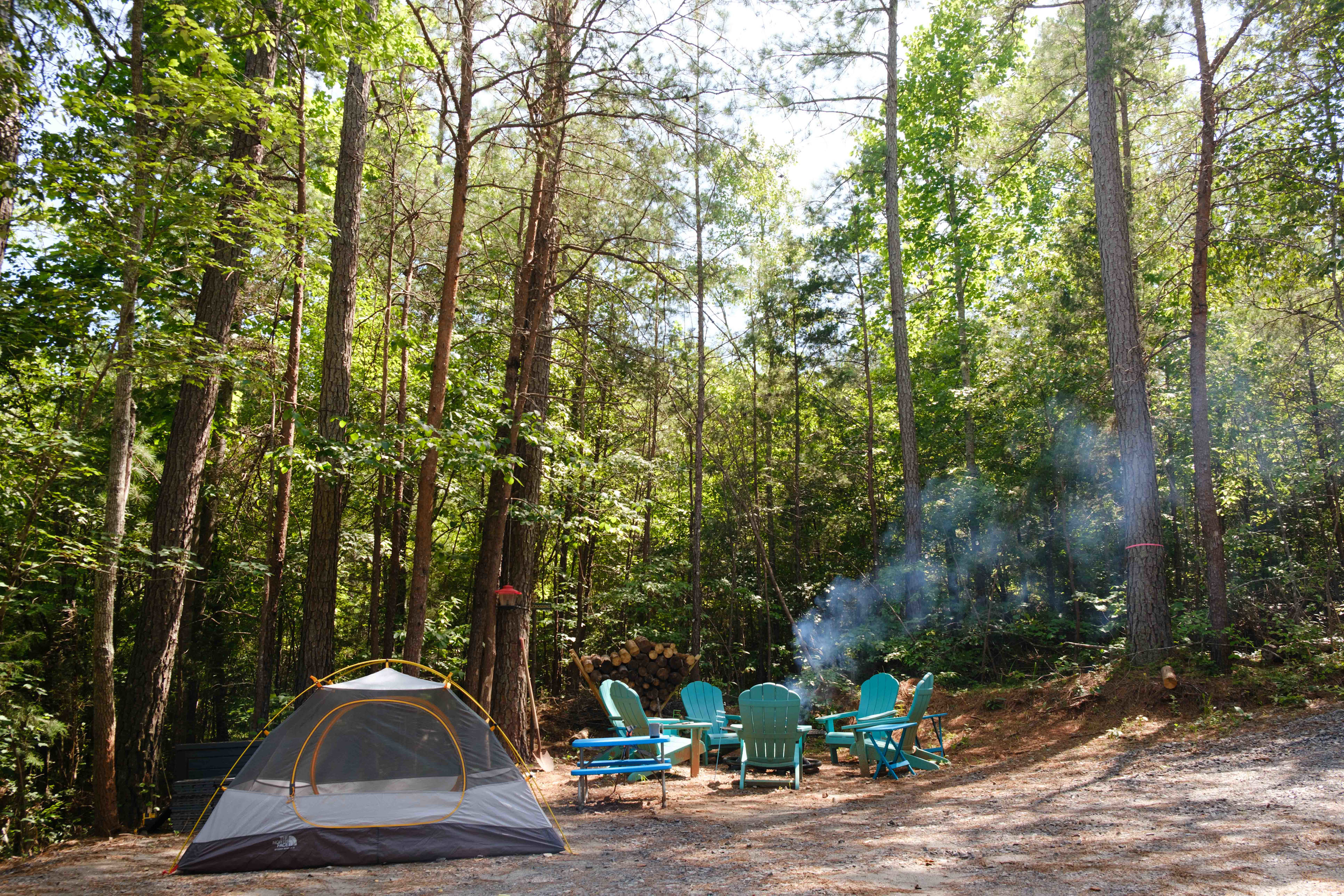 I pitched my tent close to the fire pit. They have camping pads you can set up under your tent so it's not on the gravel!