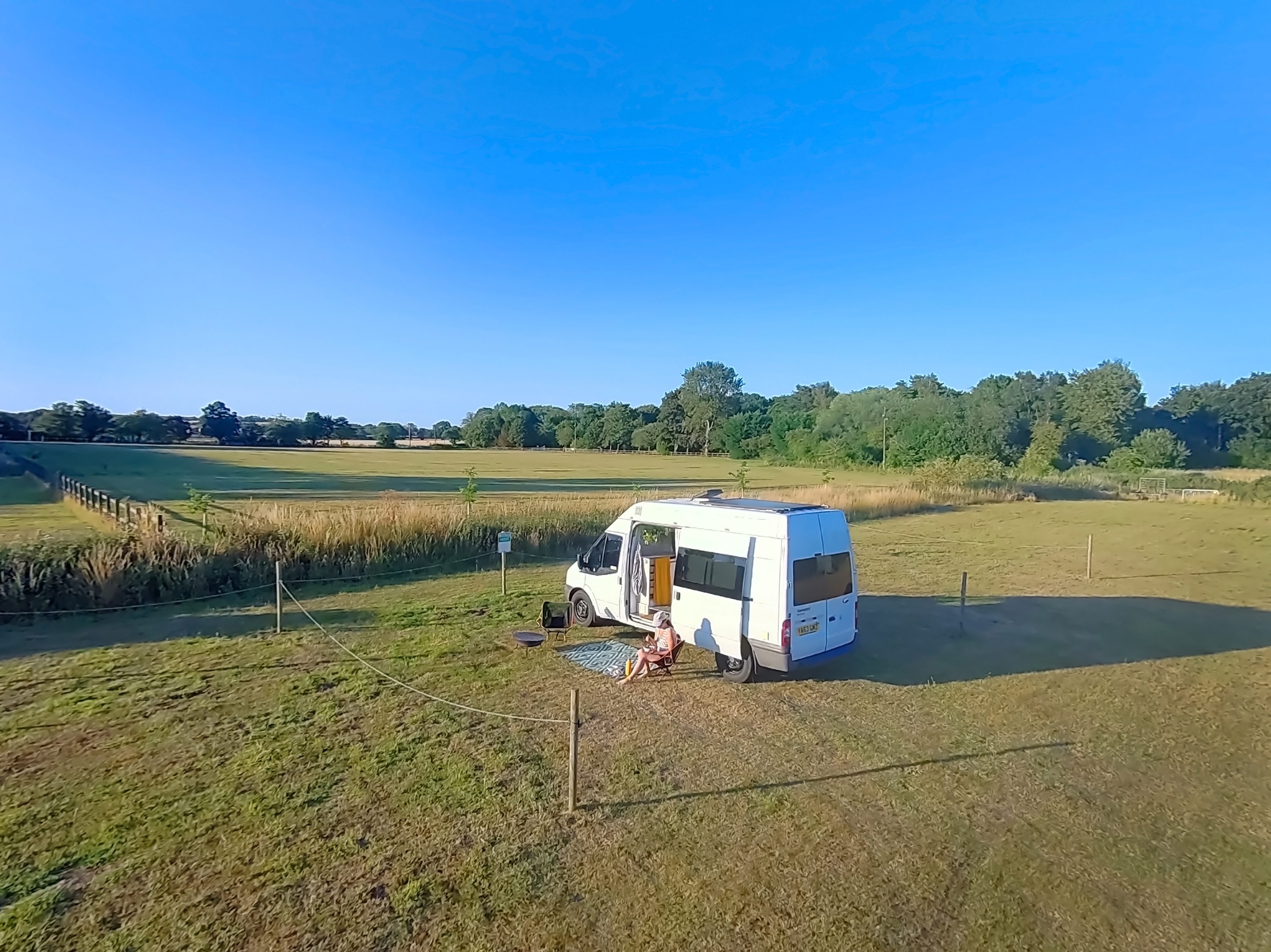 Non-electric pitch with beautiful spacious views, and van positioned to take in the evening sun, I swapped it round for overnight and morning sun from the rear of the site. Fire pits are also available to hire