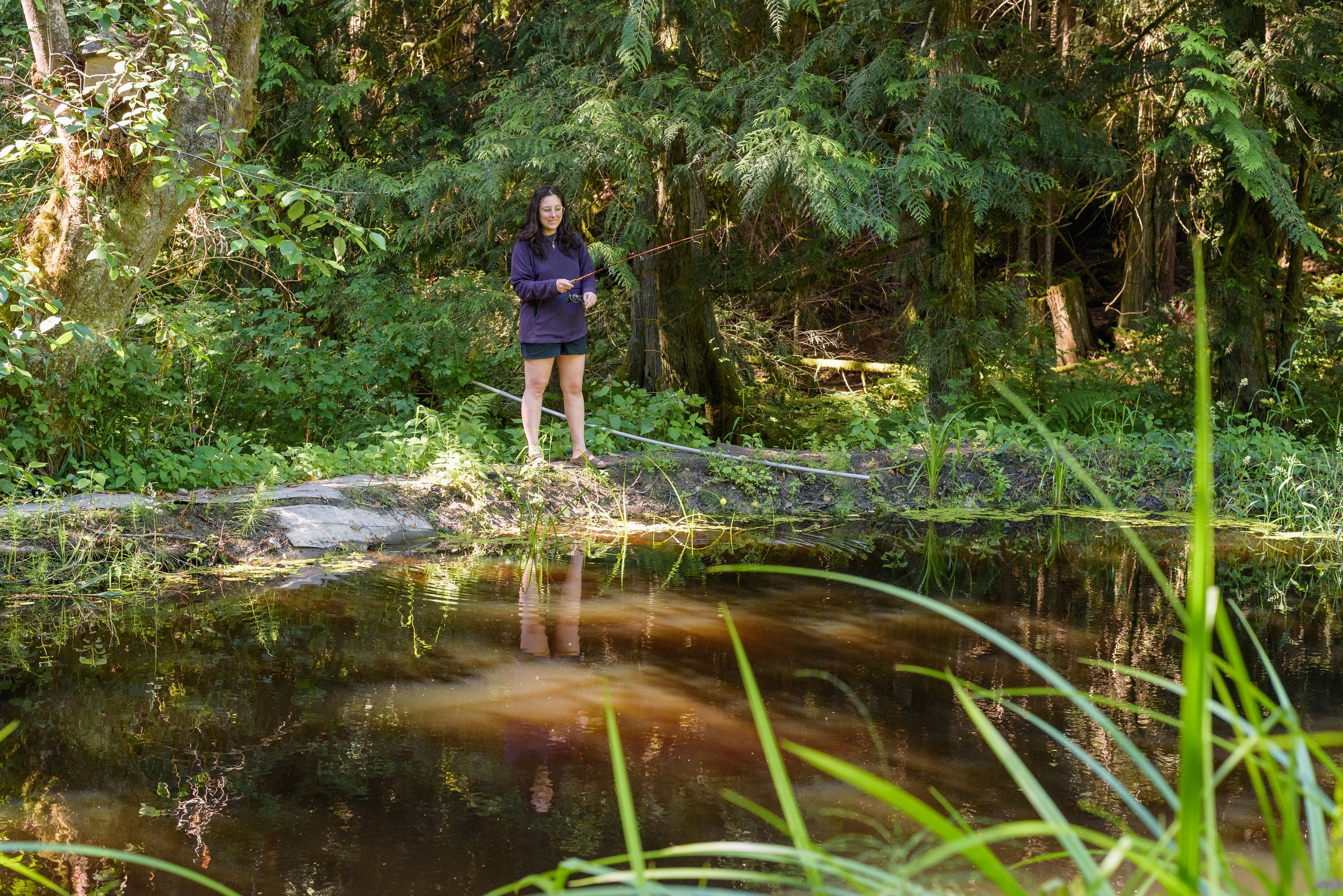 Fishing from the pond's walkway