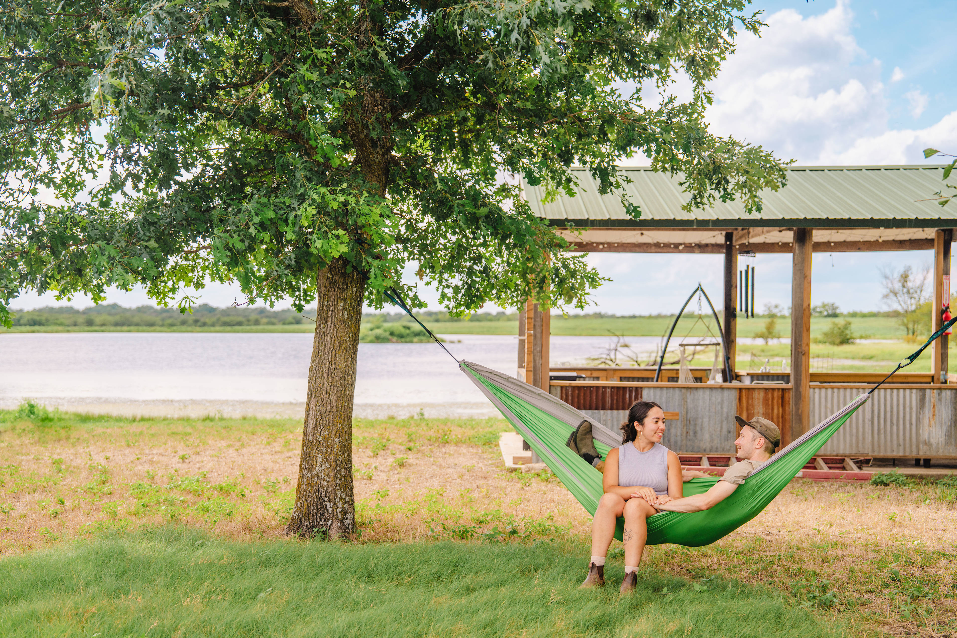enjoying the hammock Jeffrey set up for us by the pond