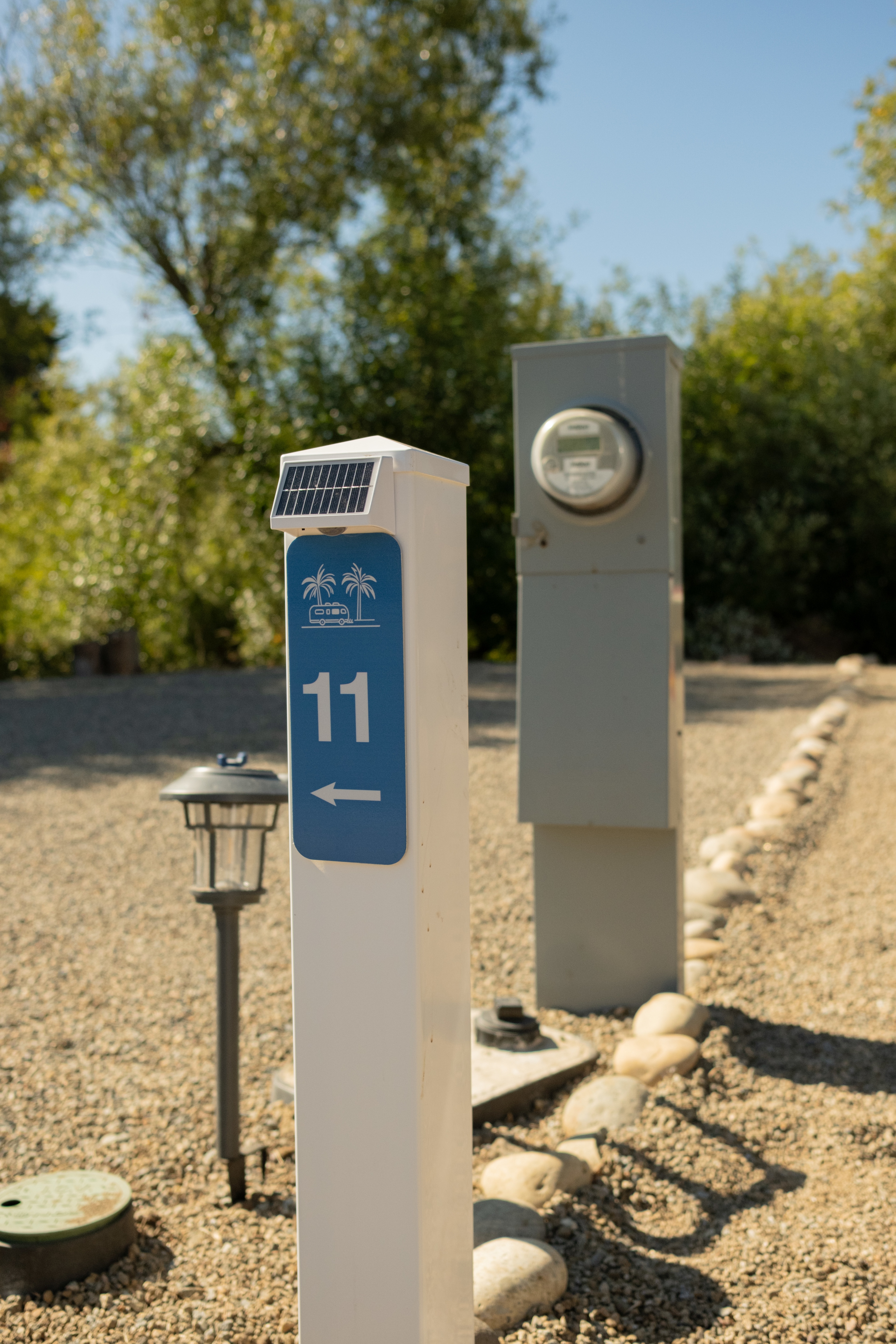 Each site has a small light, electric hookup, and site number marker. 