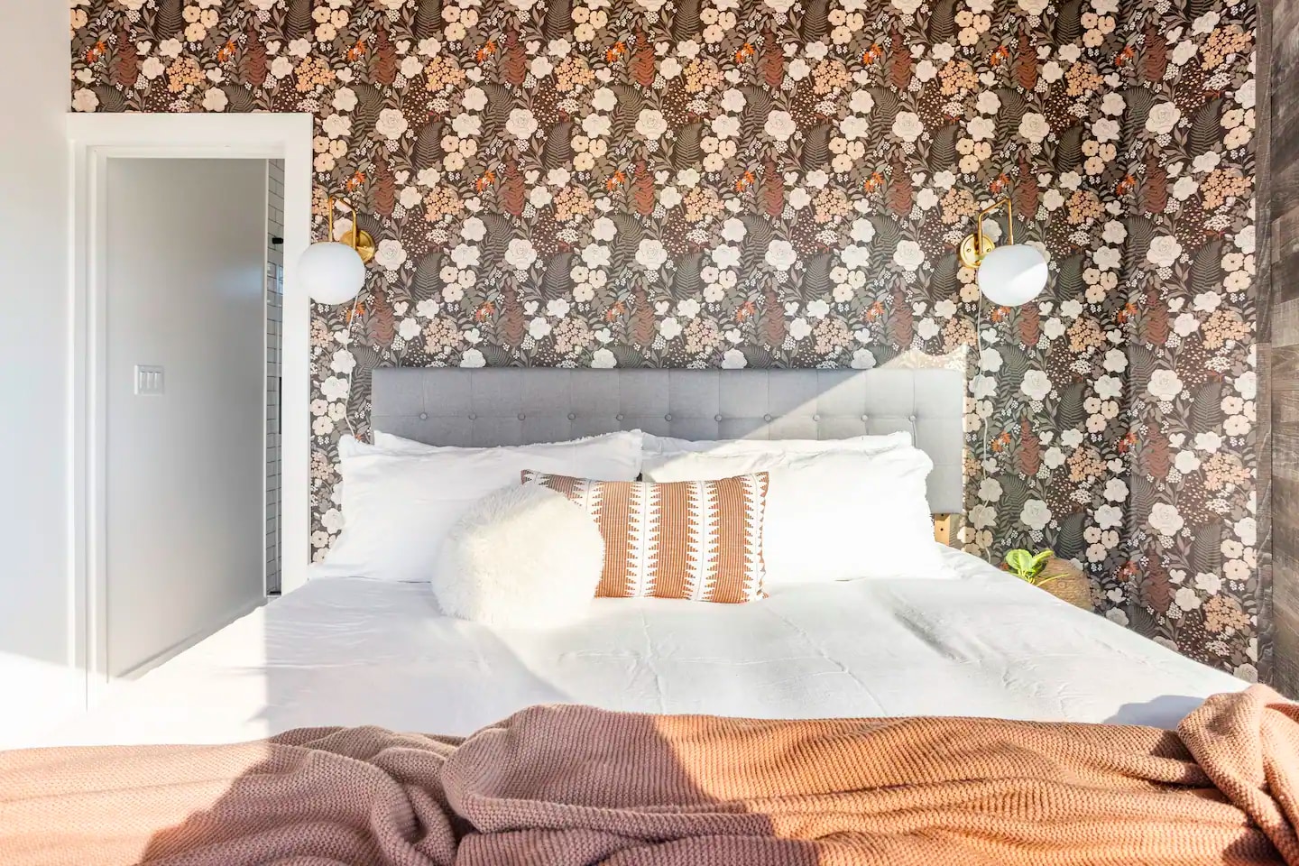 Our bathroom includes a tiled shower with hot water, flushing toilet, bathroom sink and french door that leads to the ourdoor shower.