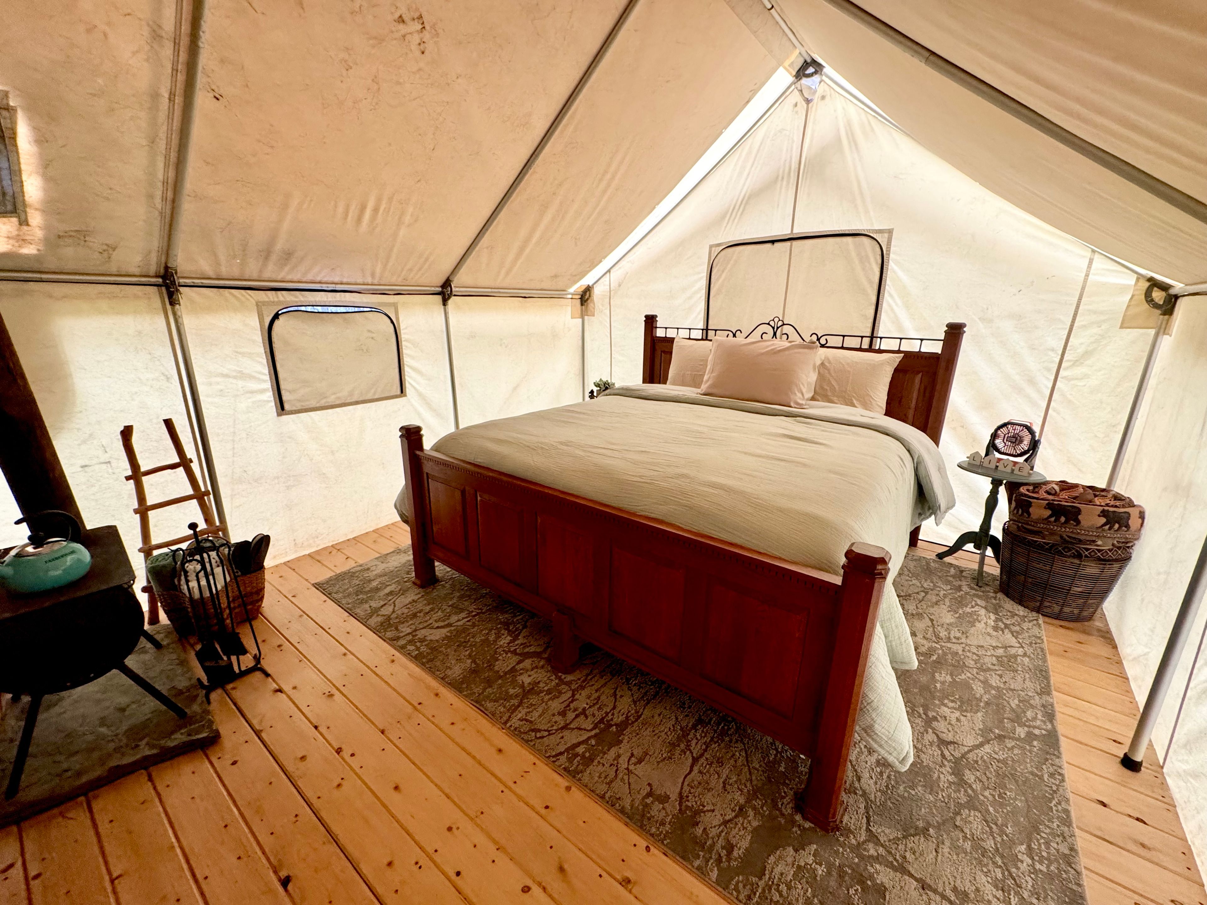 Inside look with King Bed and wood stove