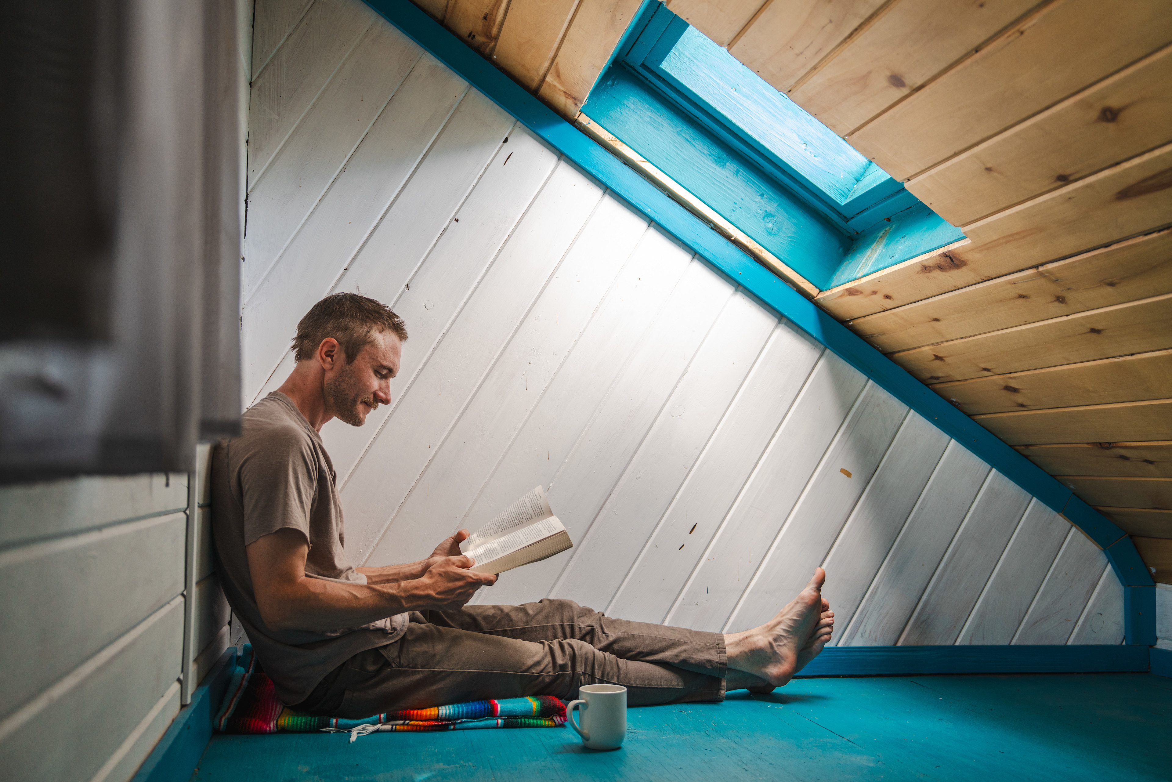 reading in the upstairs loft of the art shack