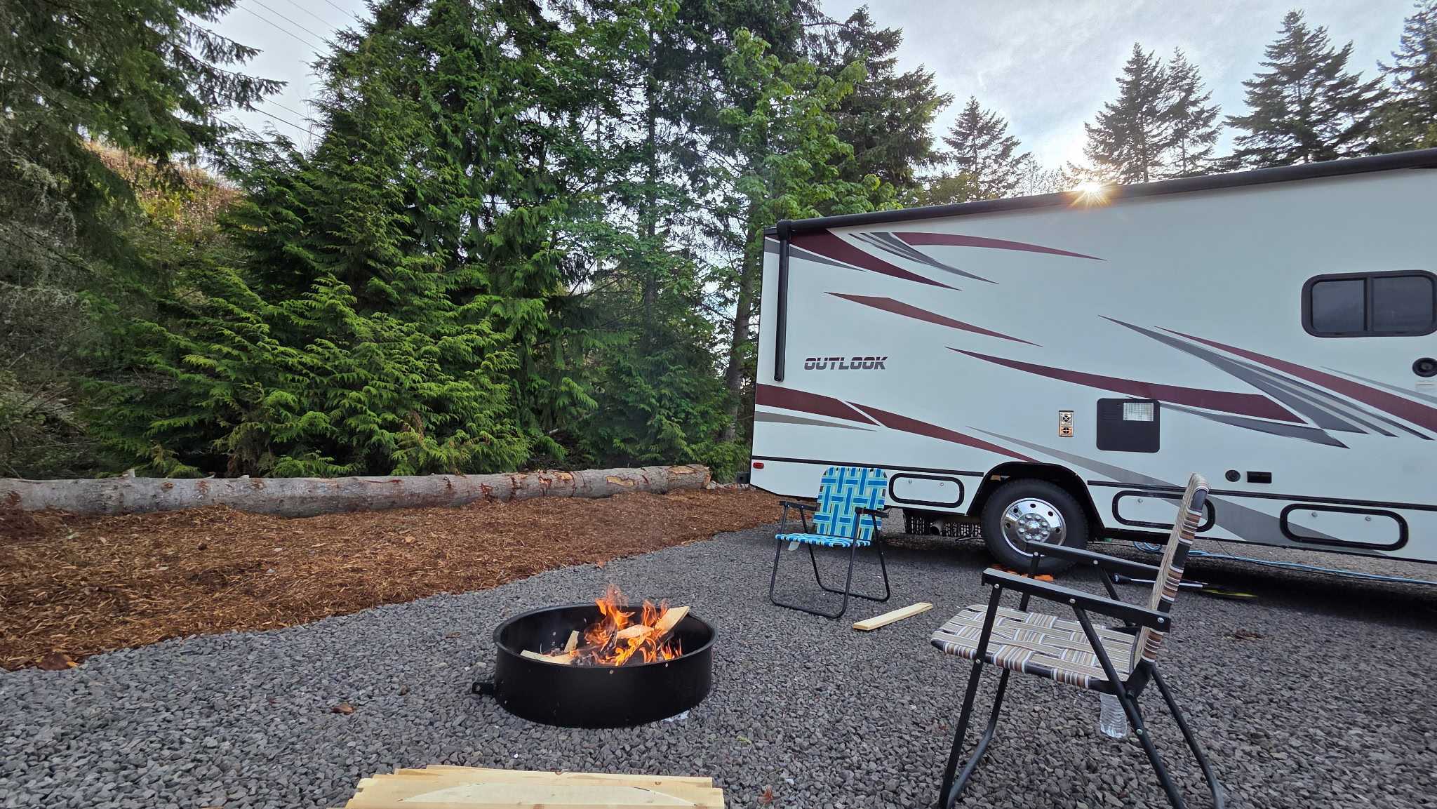 RV@Olympic standard site with burning fire in fire pit
