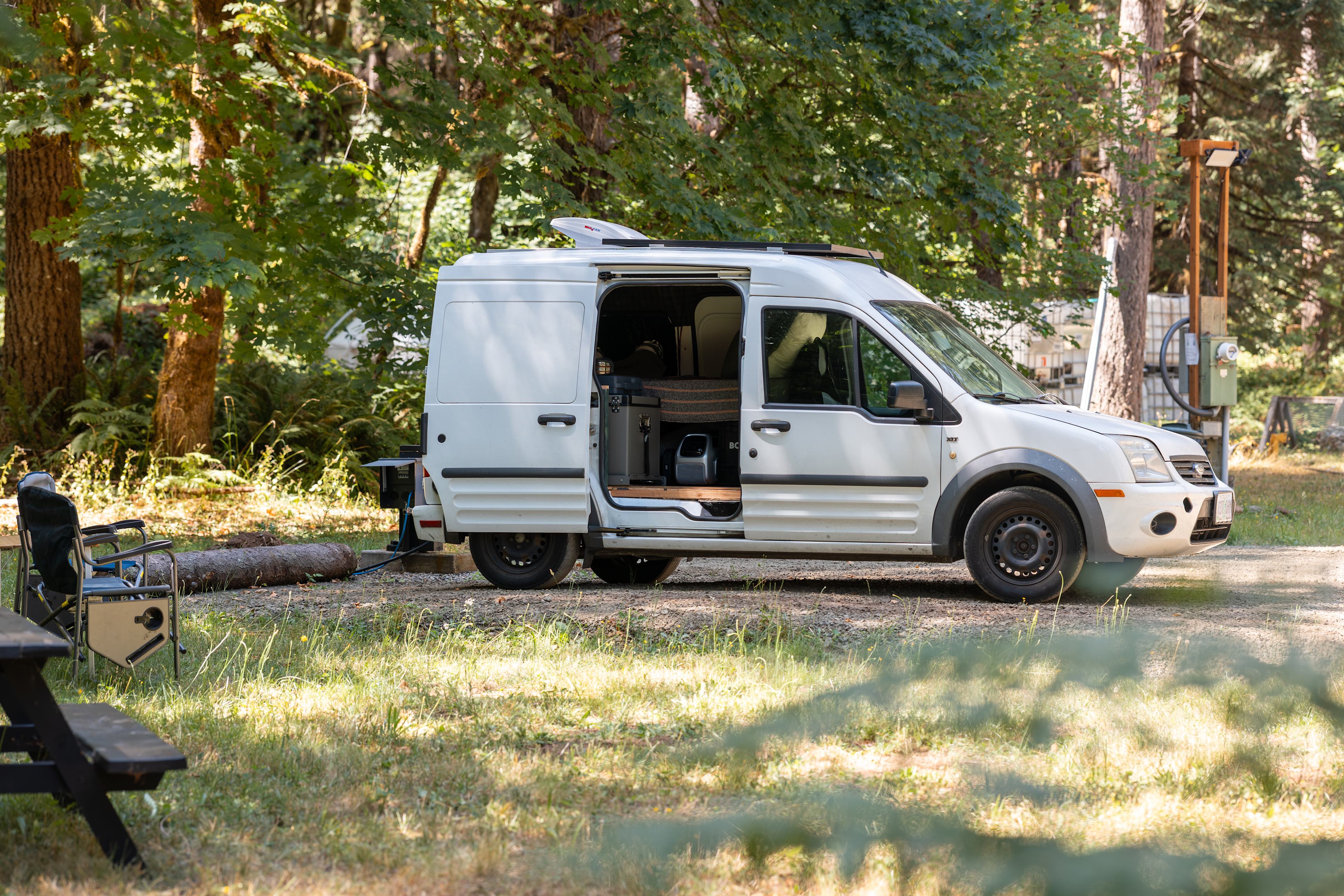 My van parked in the RV site, plenty of grassy area to enjoy next to my camper!