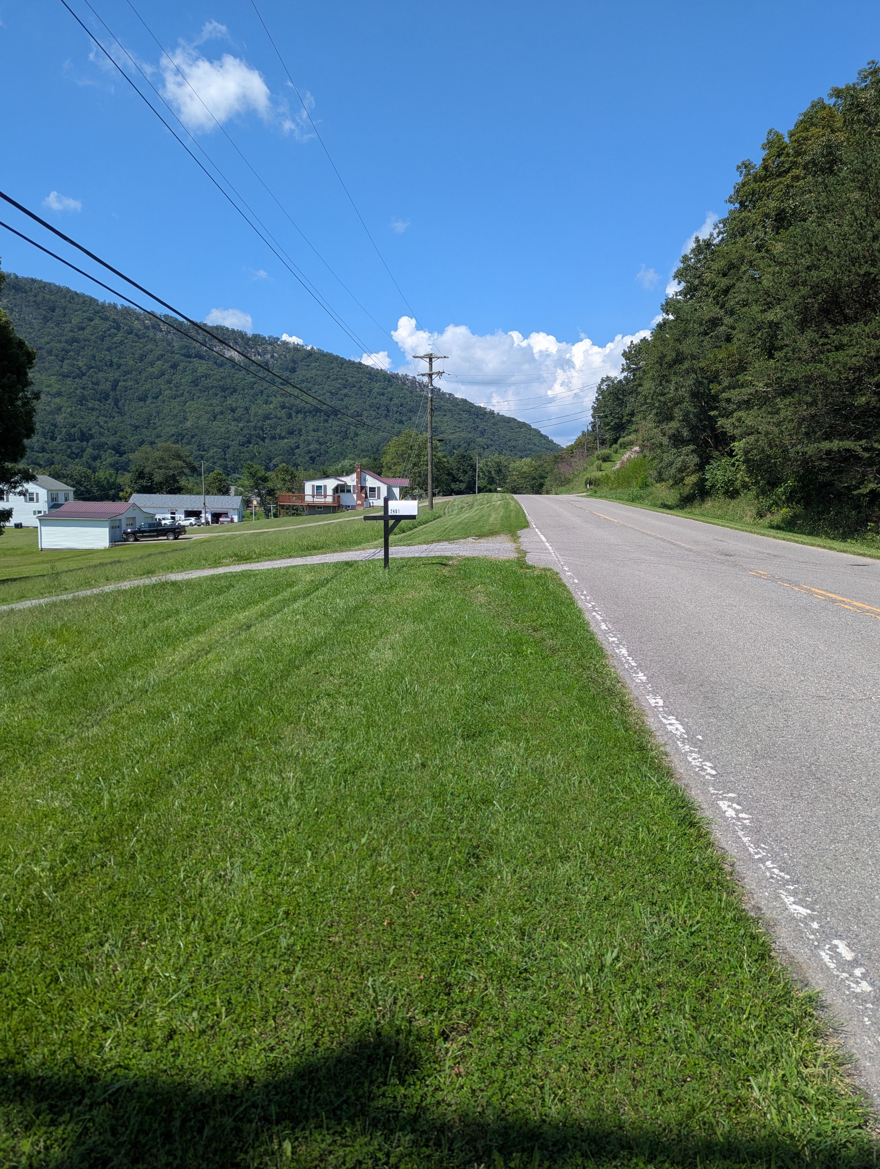 Our white mailbox and neighbors house on Big Falls Rd