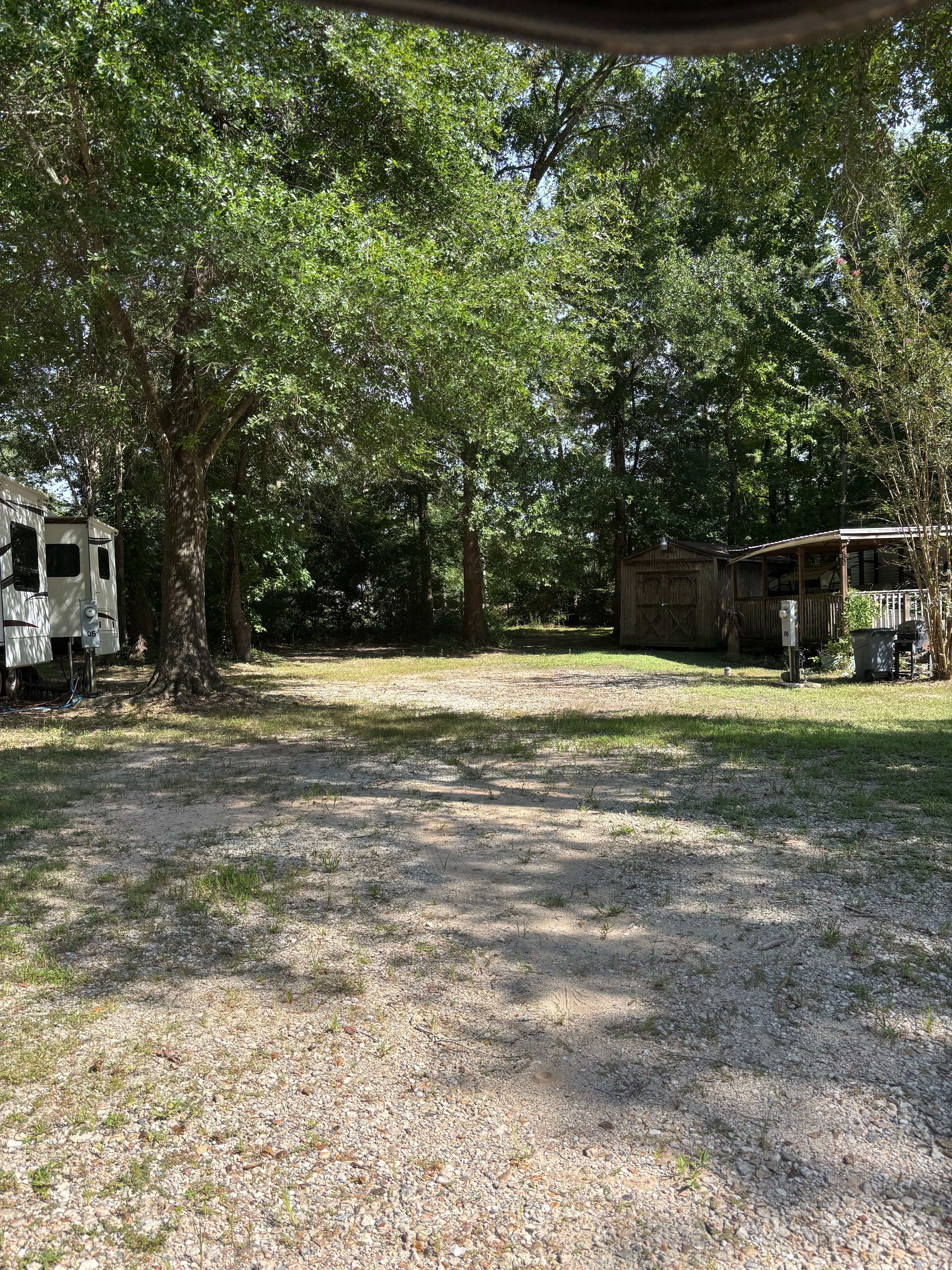Site 8 gravel back in with trees as shade