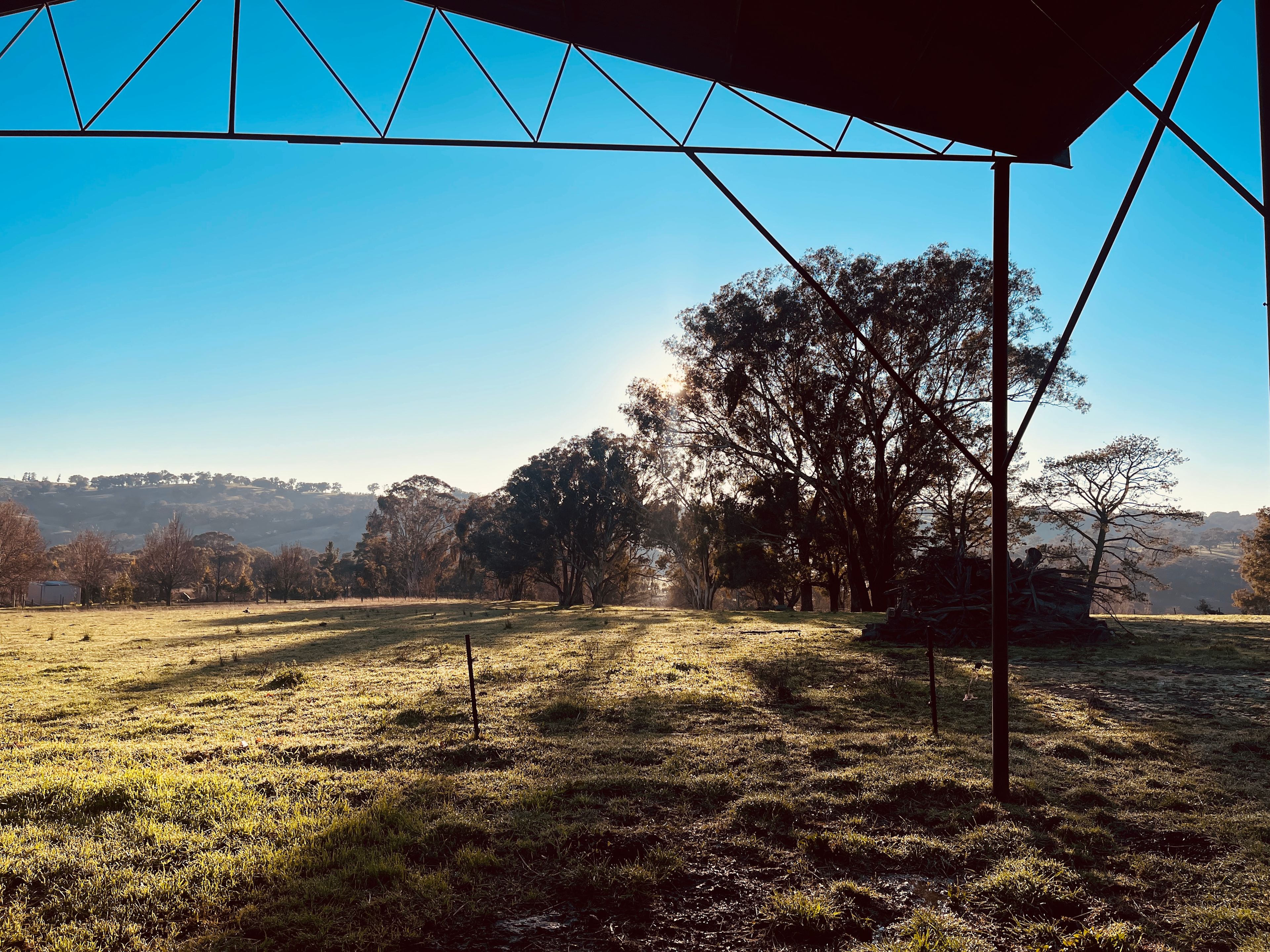 Sunrise under the hay shed