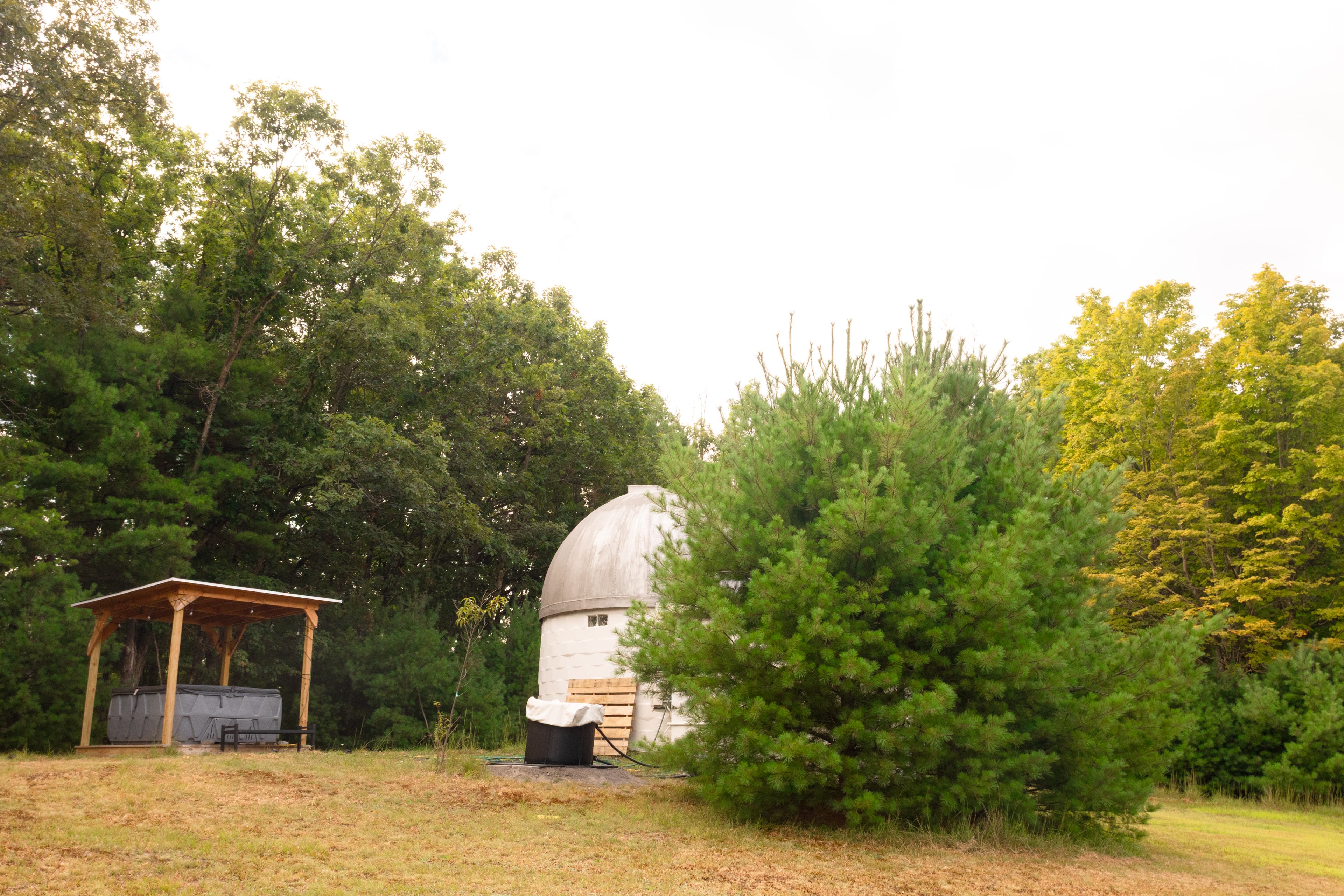 The ice bath and hot tub are up on the top of the hill just as you enter the site