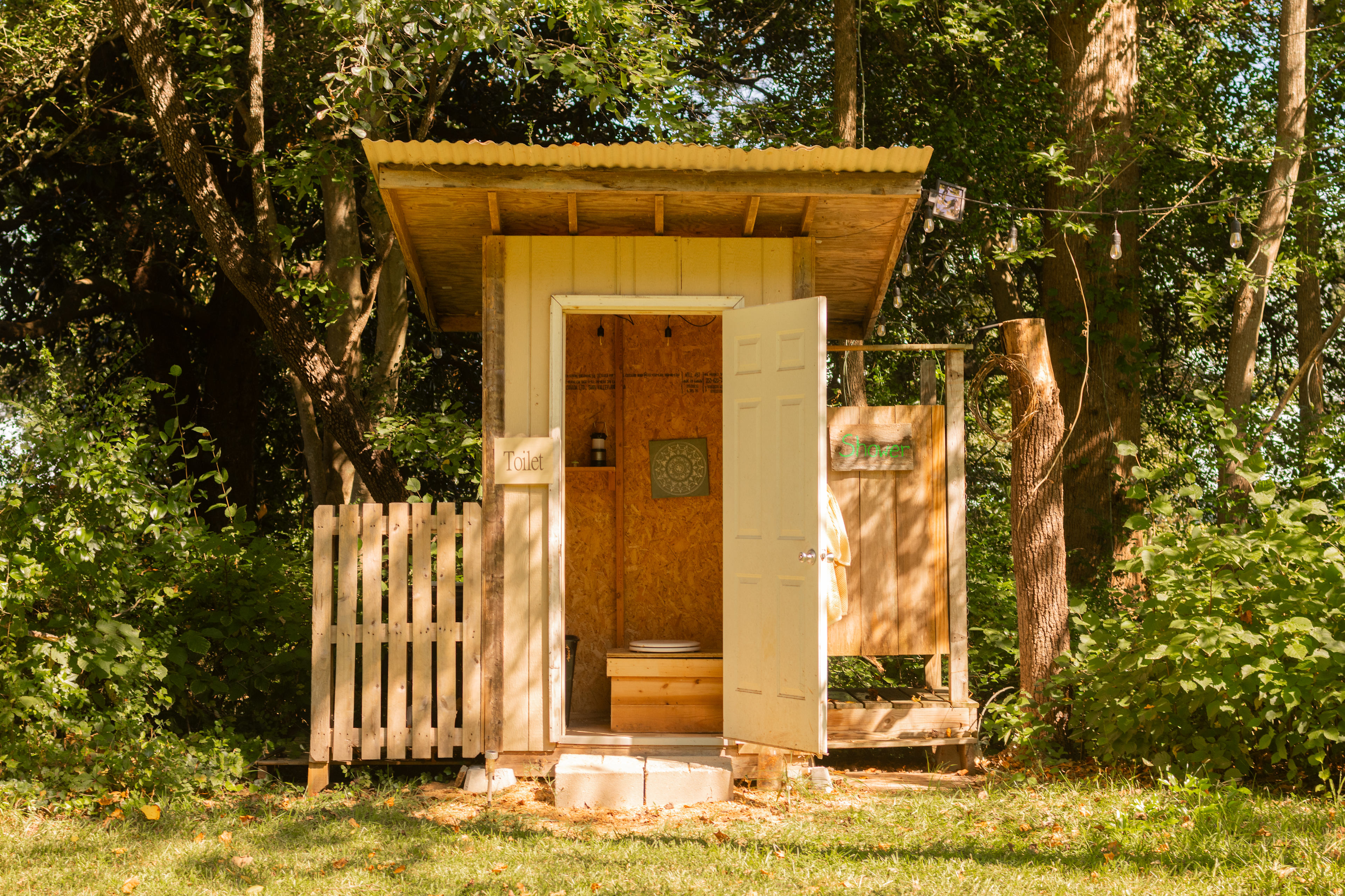 The shower/bathroom building next to the Old Cruck platform