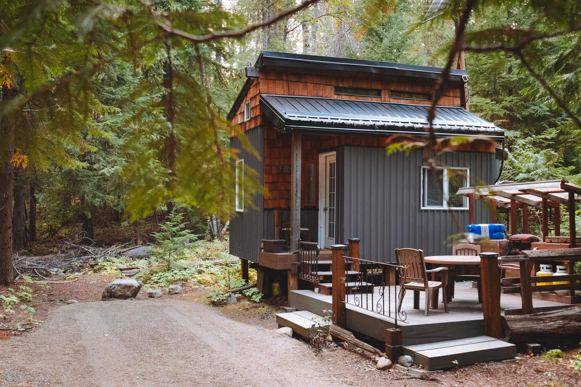 The tiny house and your parking spot amongst the trees!
