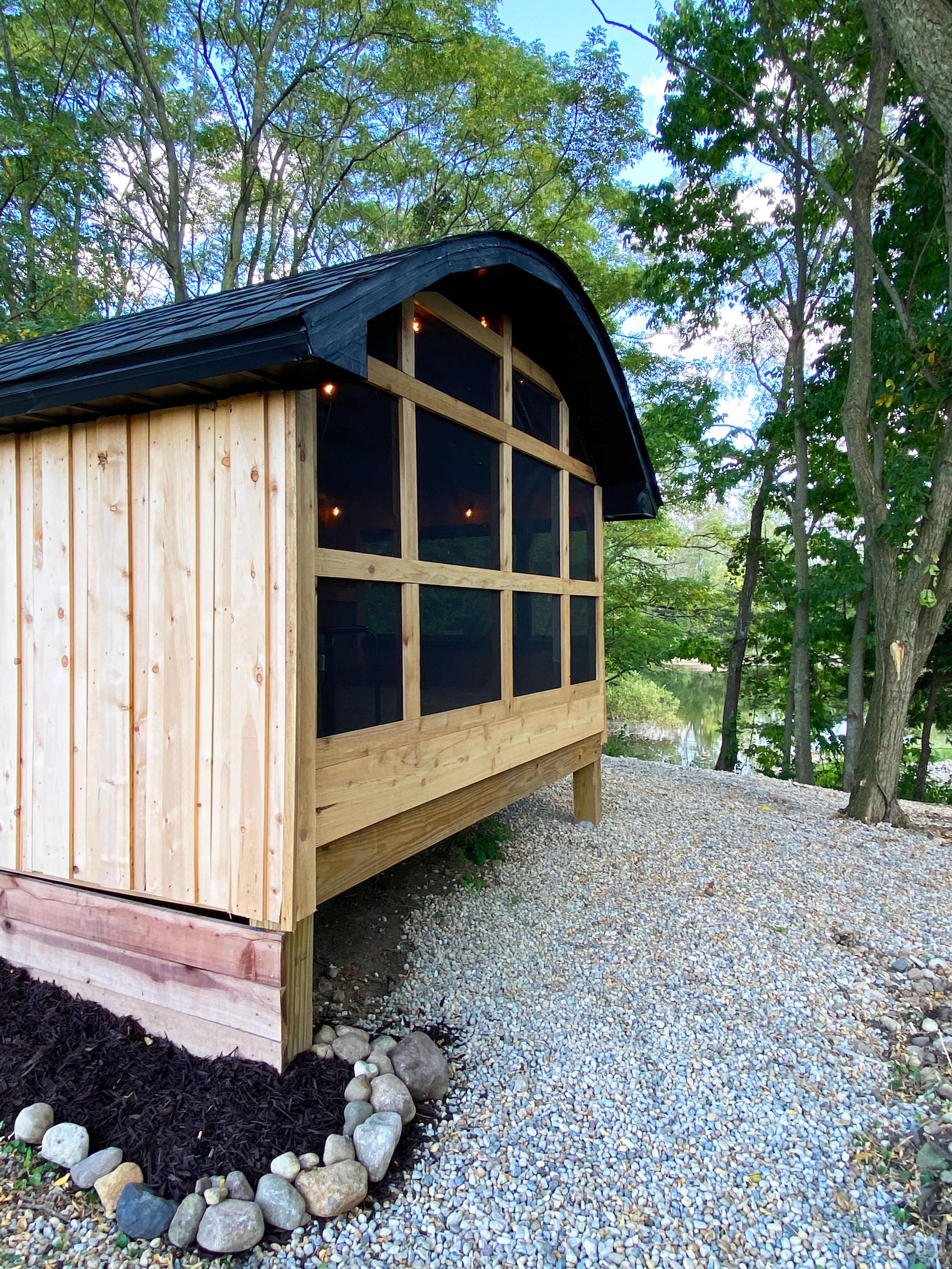 Screened porch area with pond view.