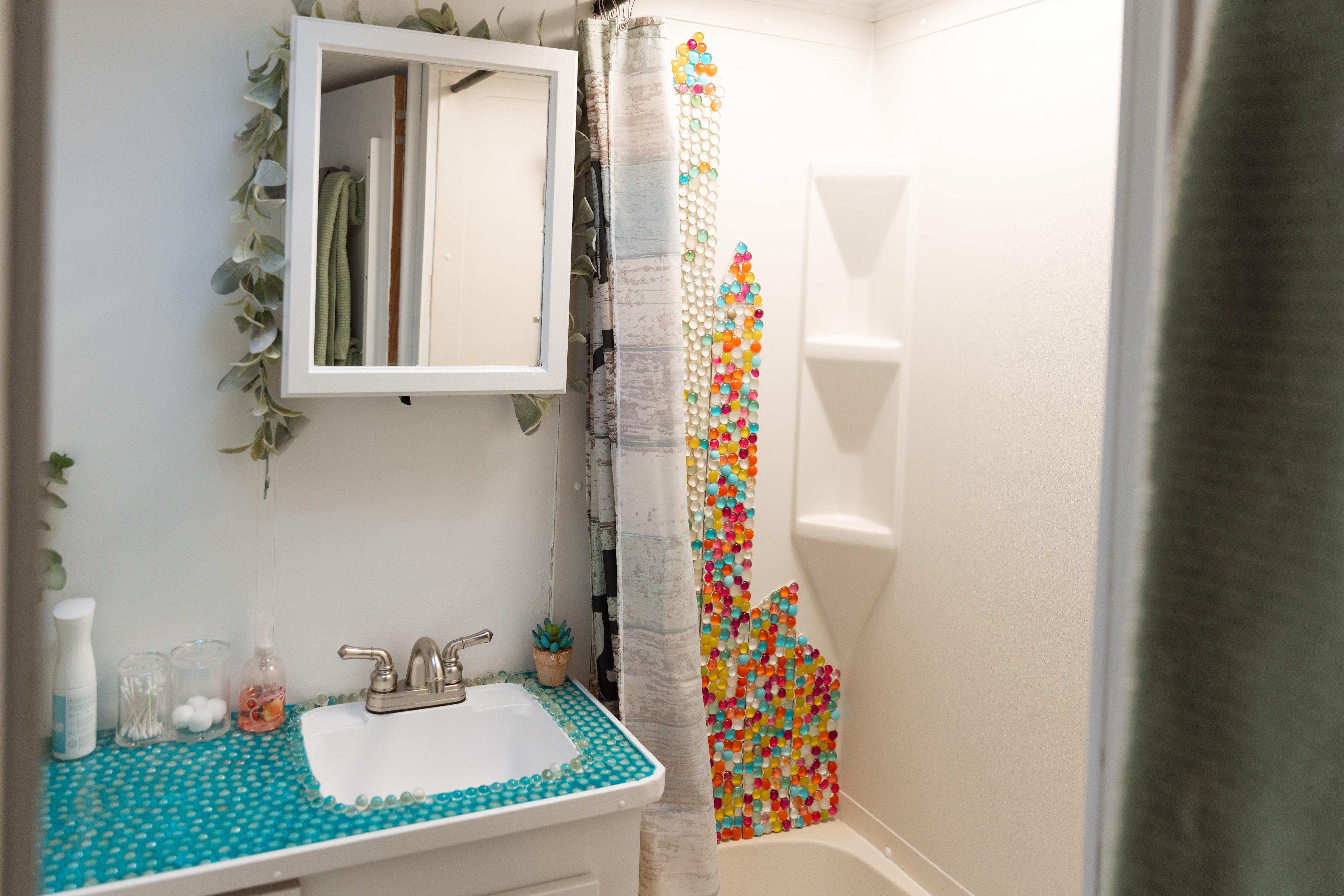 Cute bathroom with toilet, shower, and sink