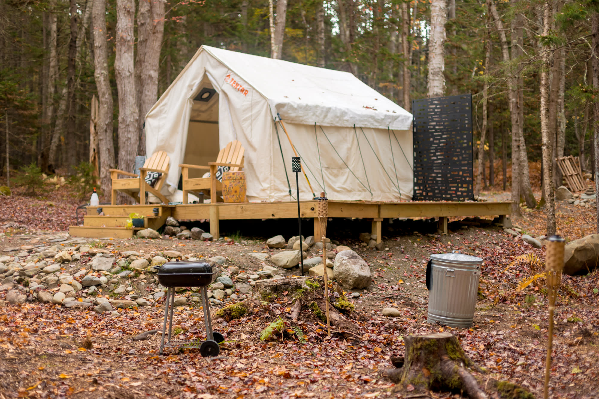 A charcoal grill and full size trash can make cooking on site easy.