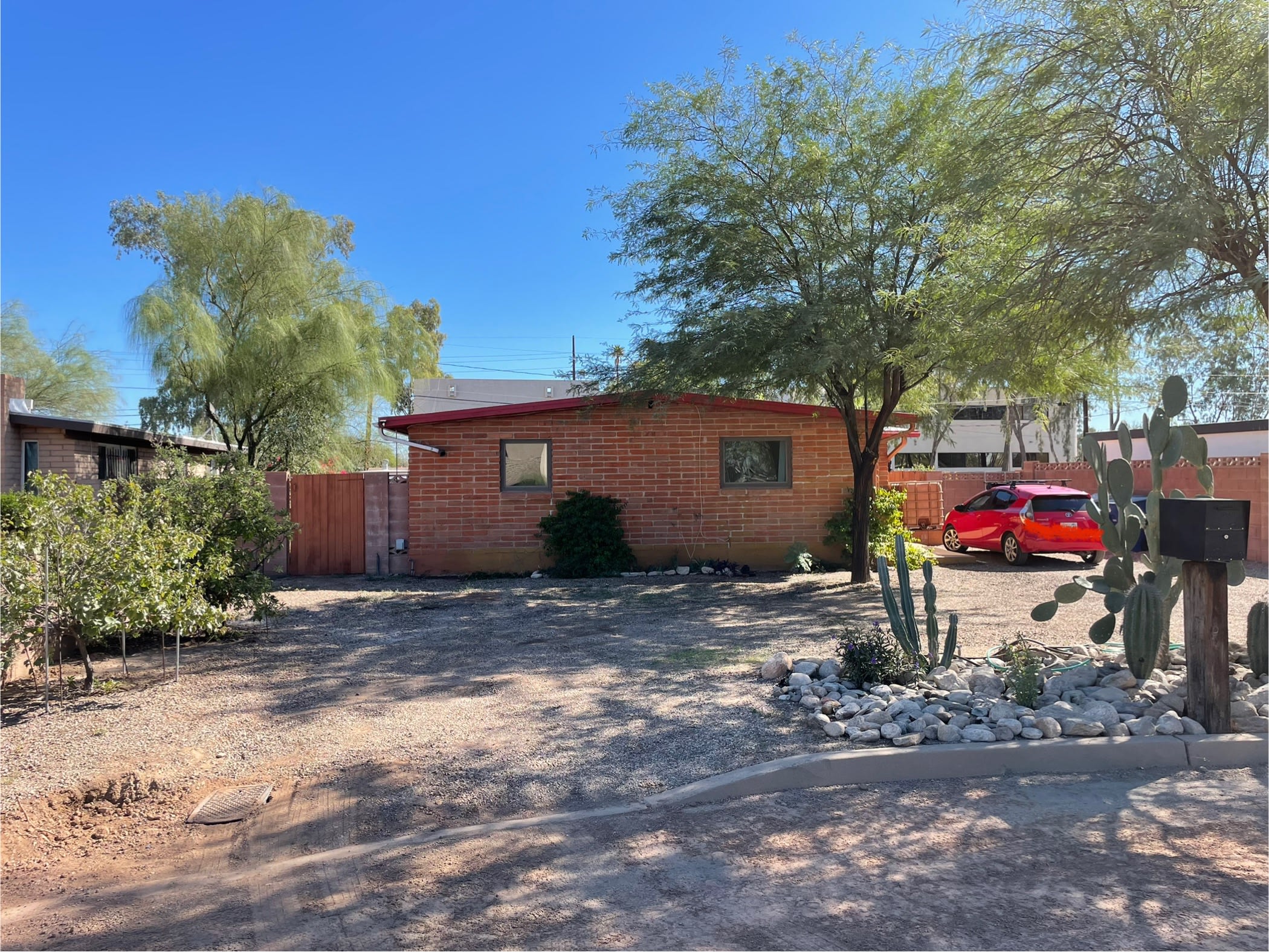 RV spot is to the left (North) of the main driveway. RV hookups are to the right of the backyard gate.

