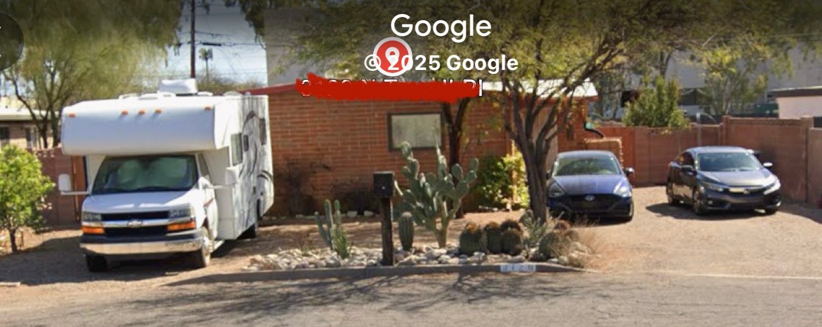 RV spot is to the north of the main driveway. Hookups are behind the RV in this pic.